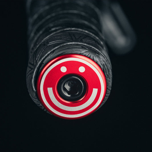 More Miles More Smiles Red bicycle bar end plugs for road and mountain bikes.