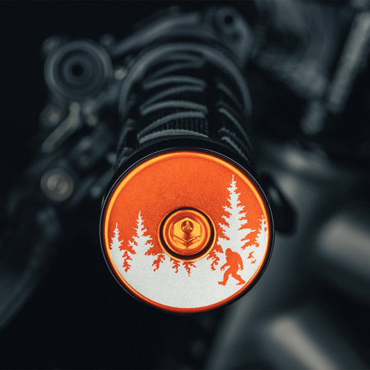 Bigfoot Hiding - Orange bicycle bar end plugs designed with a Sasquatch theme adds durability and fun to your handlebars. - Dispatch Bike