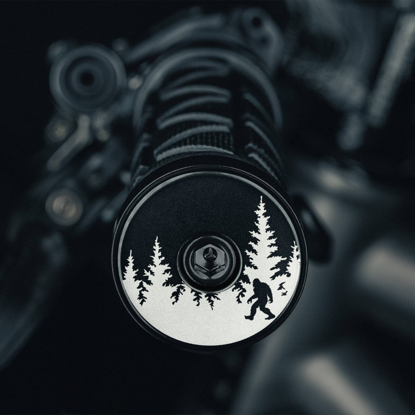 Bigfoot Hiding - Black bicycle bar end plugs with Sasquatch design for road or mountain bikes add personality and protection to handlebars.