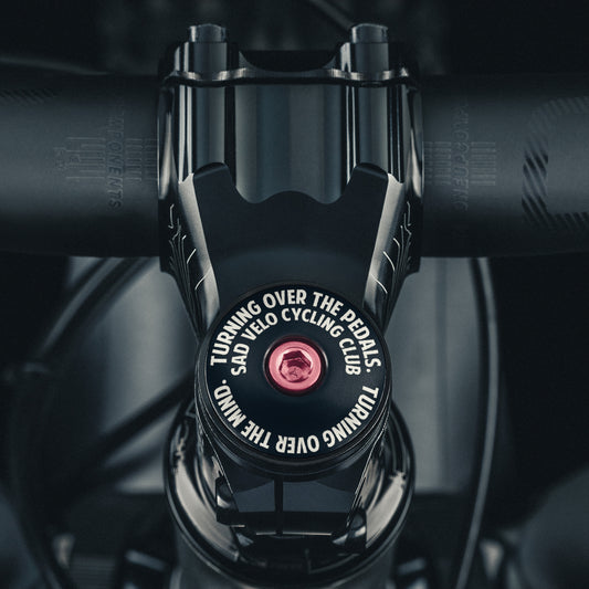 Sad Velo Cycling Club Custom Bicycle Headset Cap for road or mountain bikes, designed to fit 1 1/8" steerer tubes.