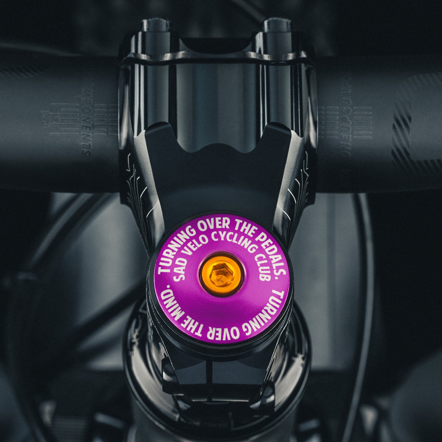 Sad Velo Cycling Club Custom Bicycle Headset Cap for bicycles, made from durable aluminum and fits 1 1/8" steerer tubes.