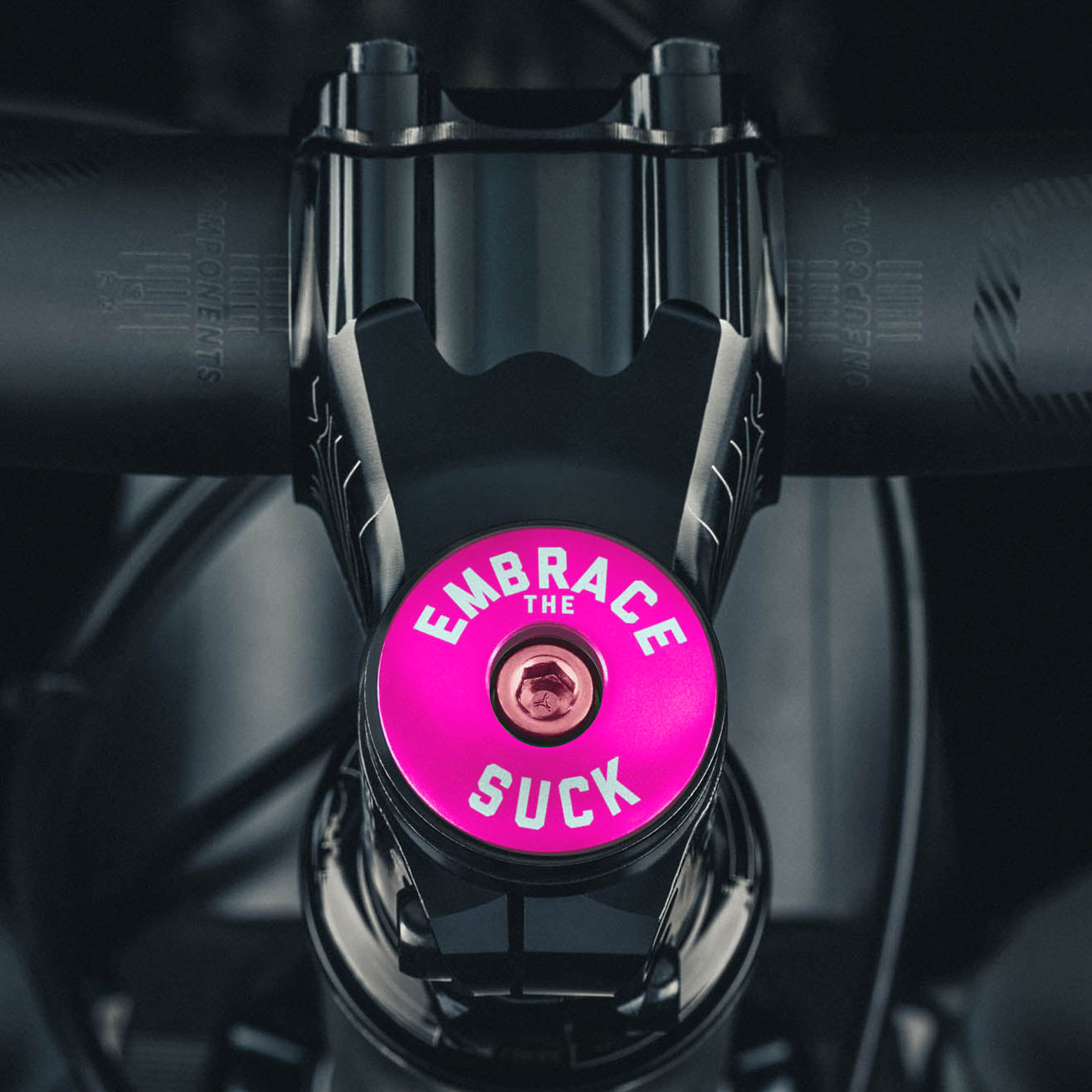 Hot pink top cap designed for your bike stem for a personalized and functional cycling accessory.