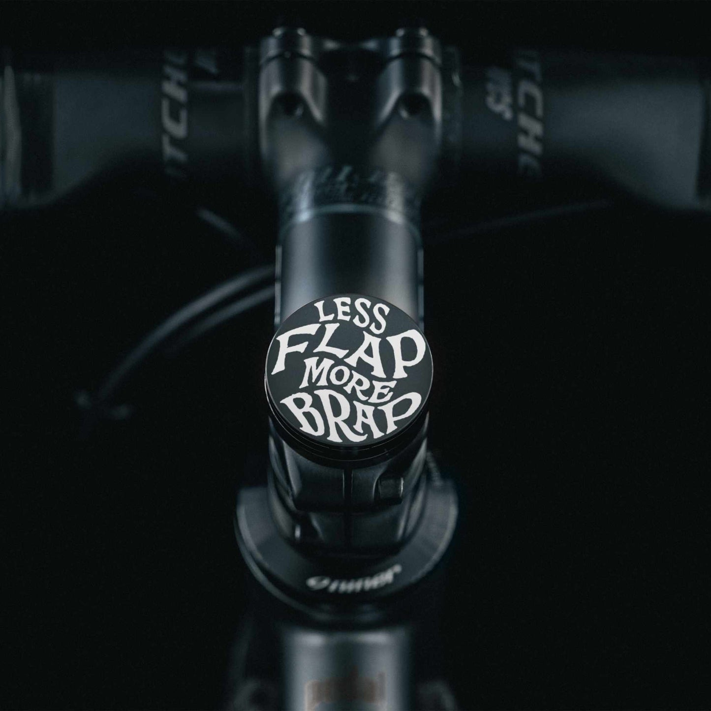 Less Flap More Brap - Shapeshifter Bicycle Headset Cap with flat top design and no center hole for custom-finished bike stem cap.