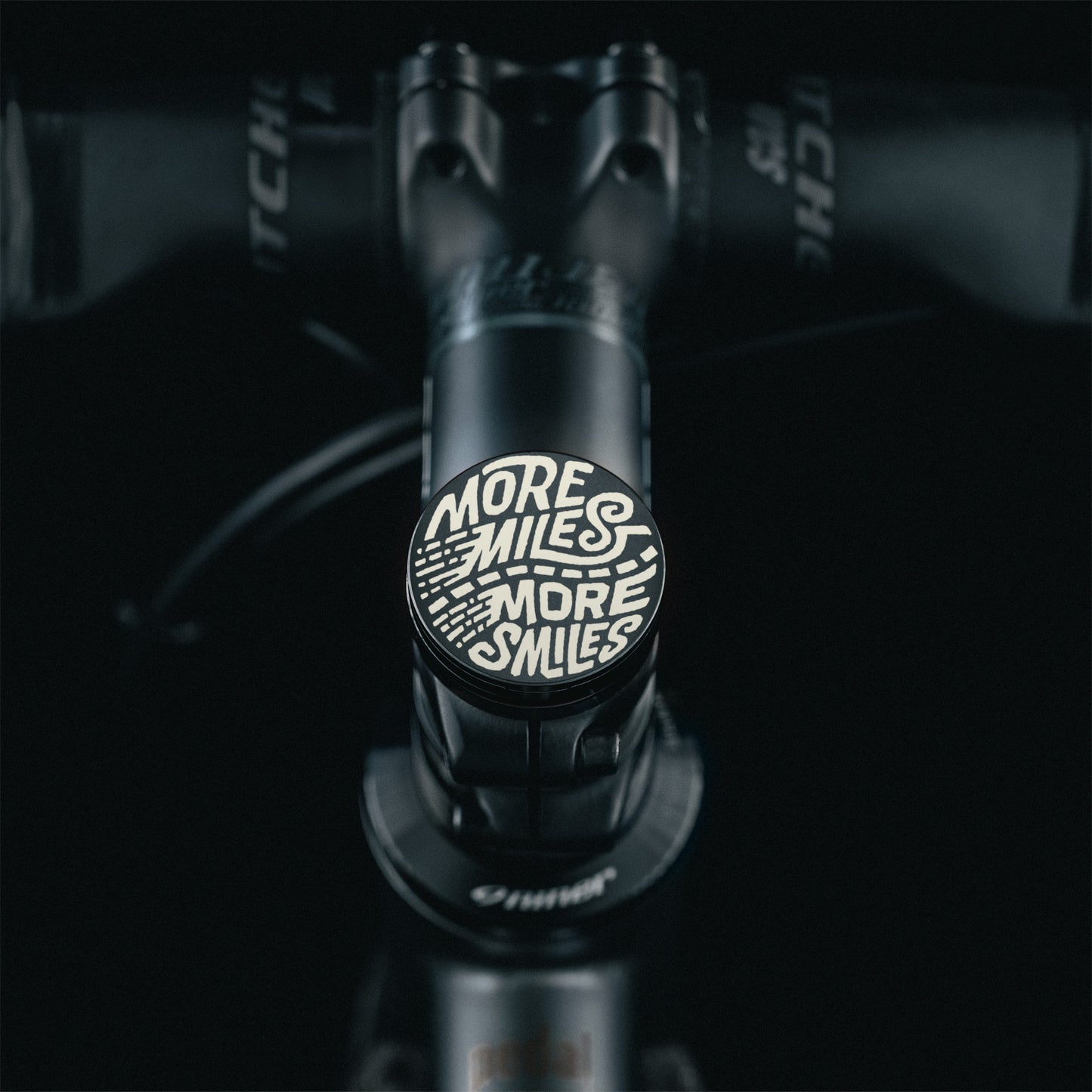 Black flat bike stem cap with a no-hole center design crafted from precision-machined aluminum for modern bicycles.