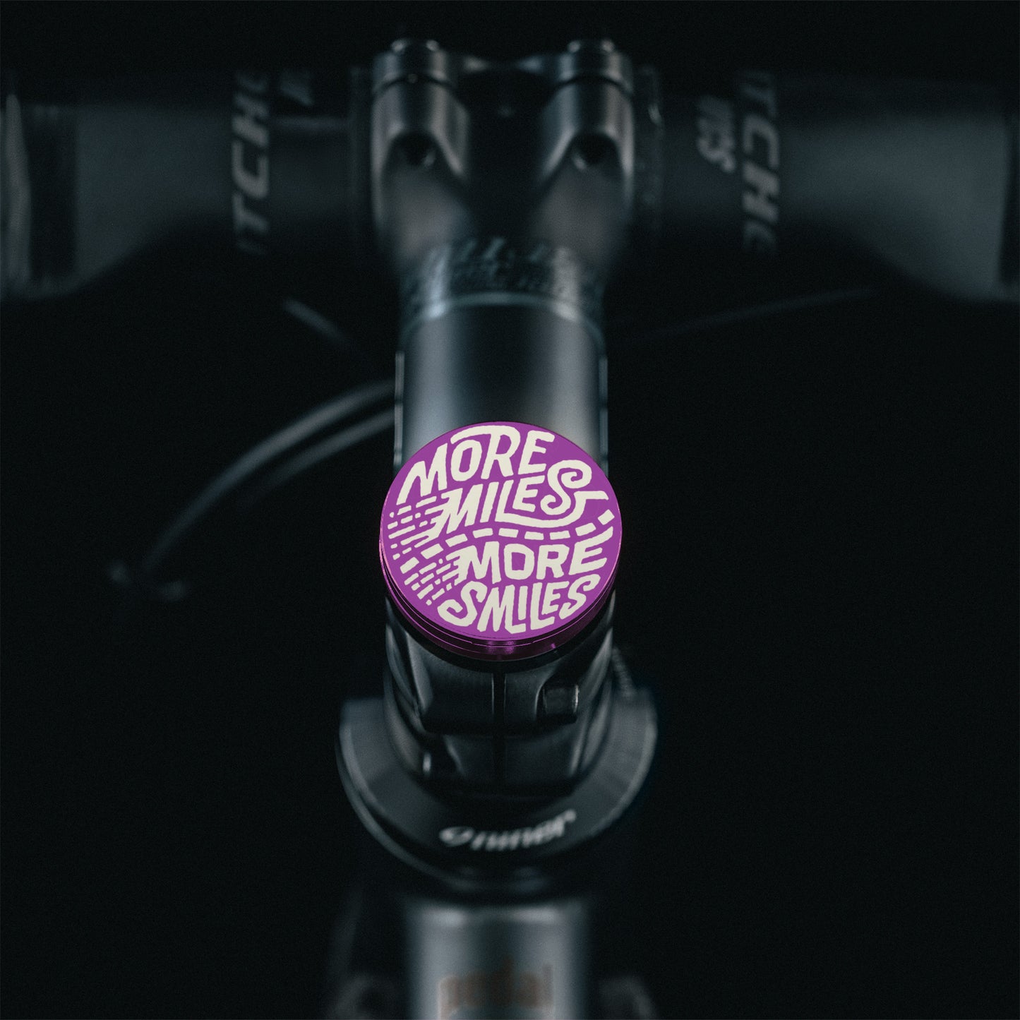 Purple bike headset top cover with a centerless flat top design for quick and easy customization.