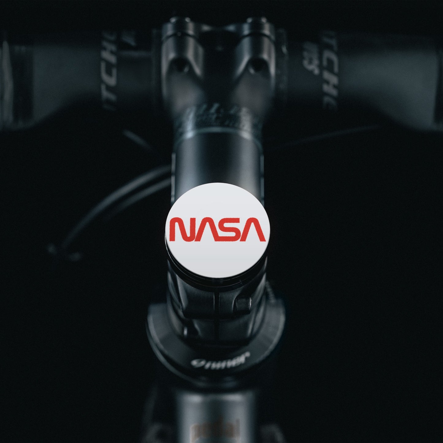 Shapeshifter bike top cap designed with NASA worm logo.
