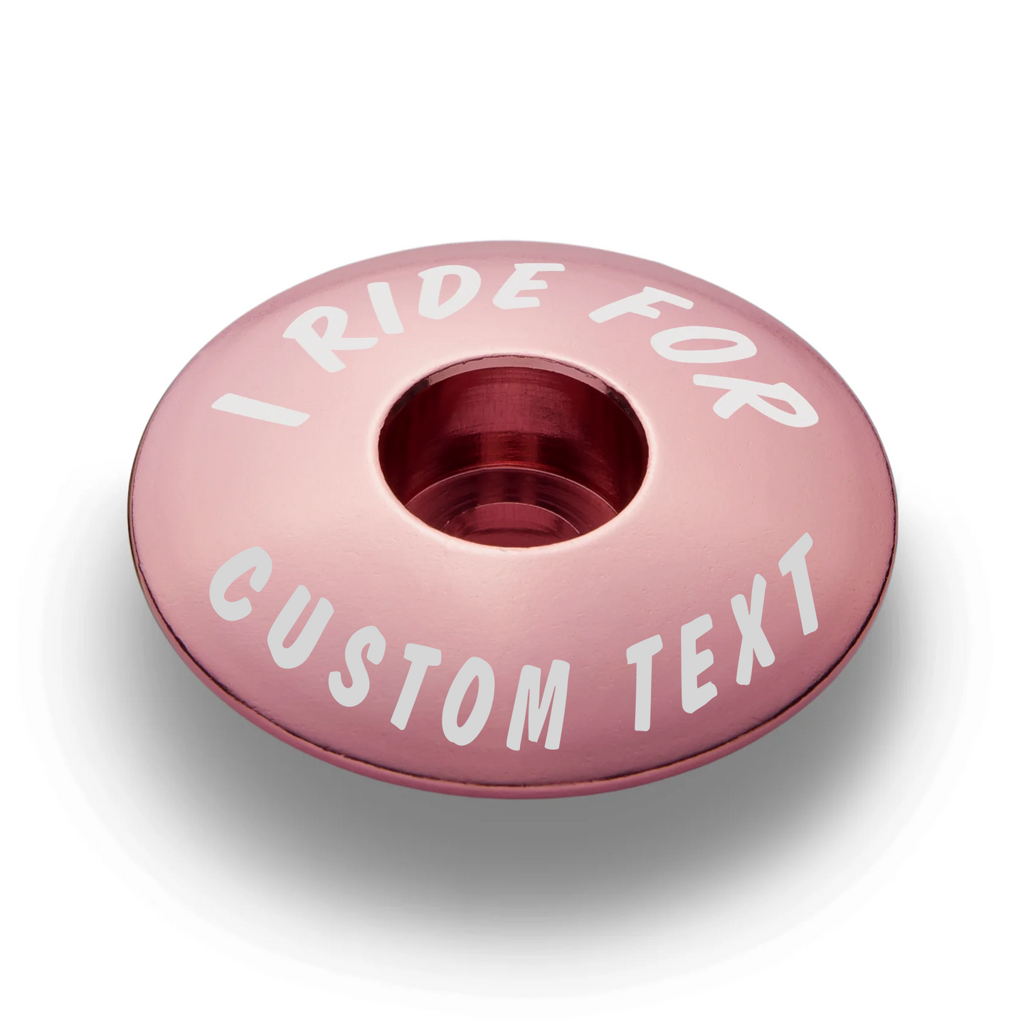 Pink stem top cap offering a colorful and personalized bike accessory