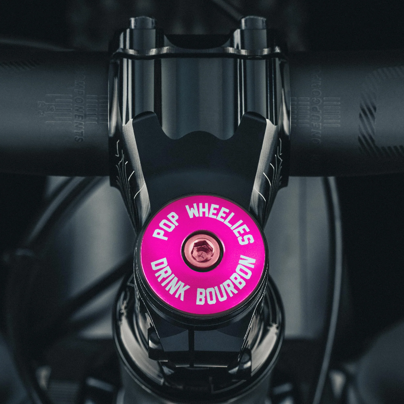 A hot pink top cap adds a bold and unique look to your cycling gear.