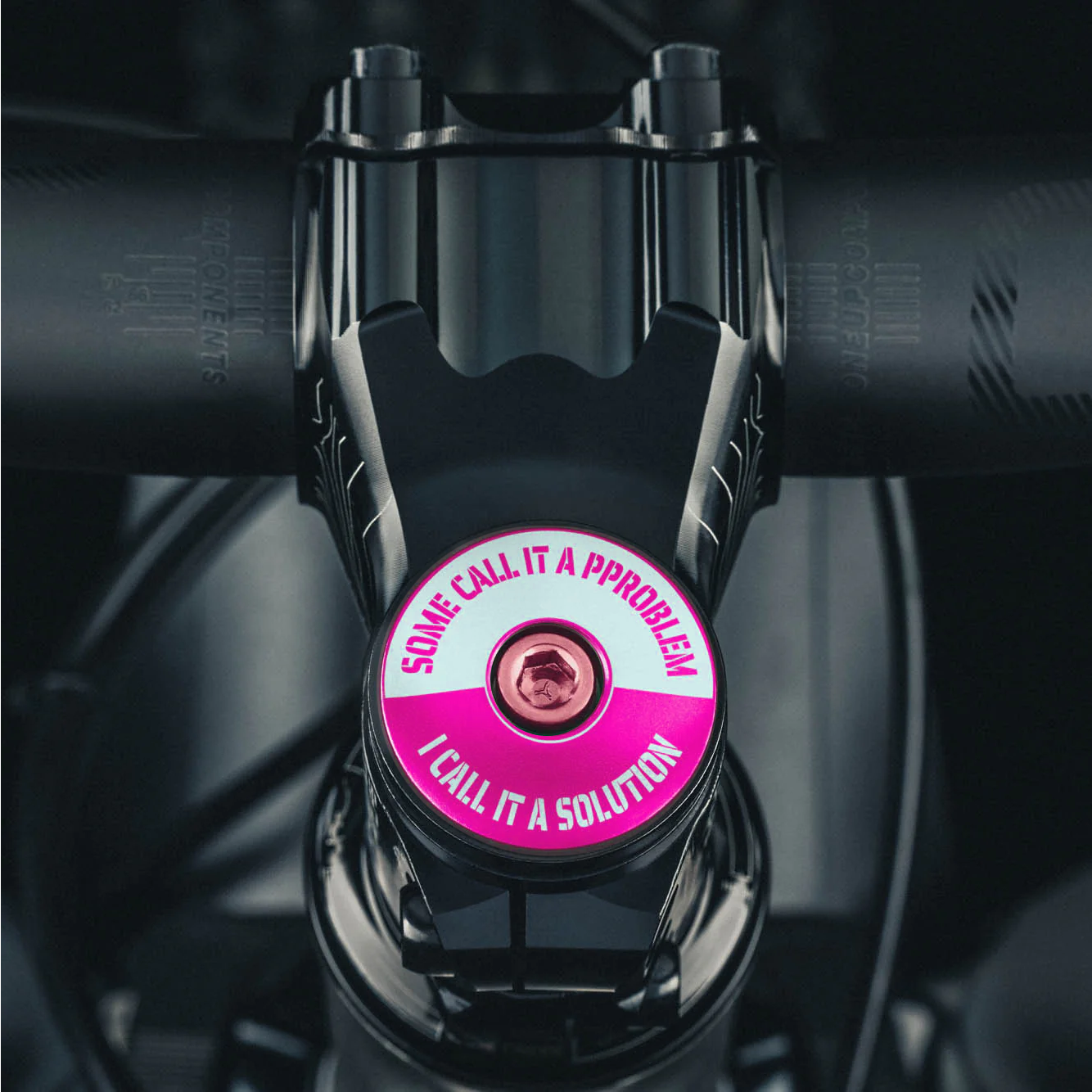 A hot pink stem top cap adds a unique custom style to your bicycle headset.
