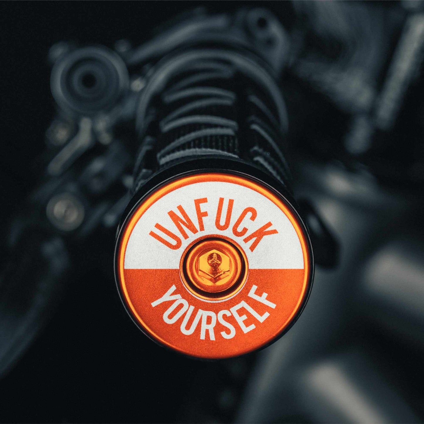 Bar end plugs mountain bike style in orange for added flair.