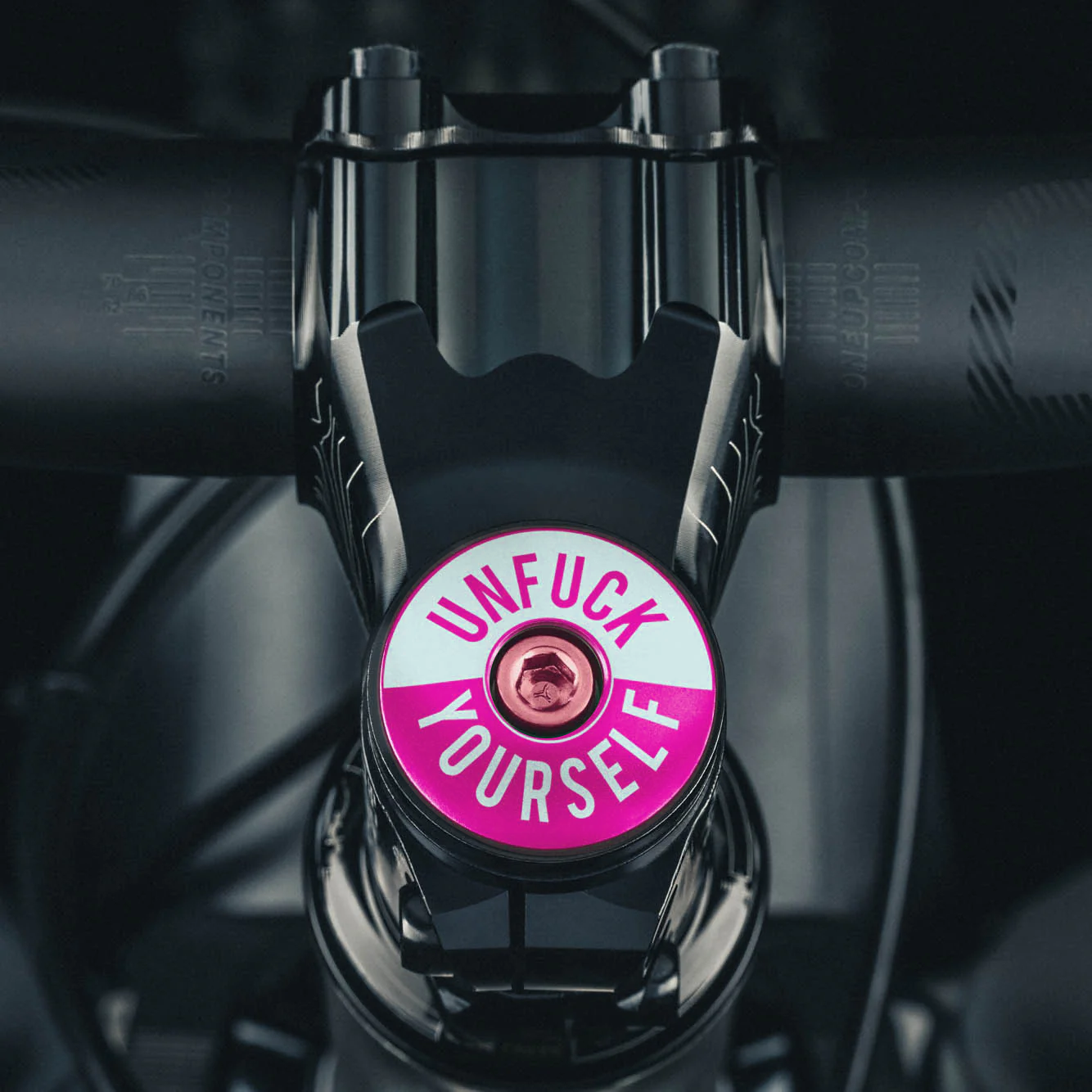 bike stem cap for 1 1/8-inch steerer tube crafted from lightweight 6061 aluminum with a bold design.