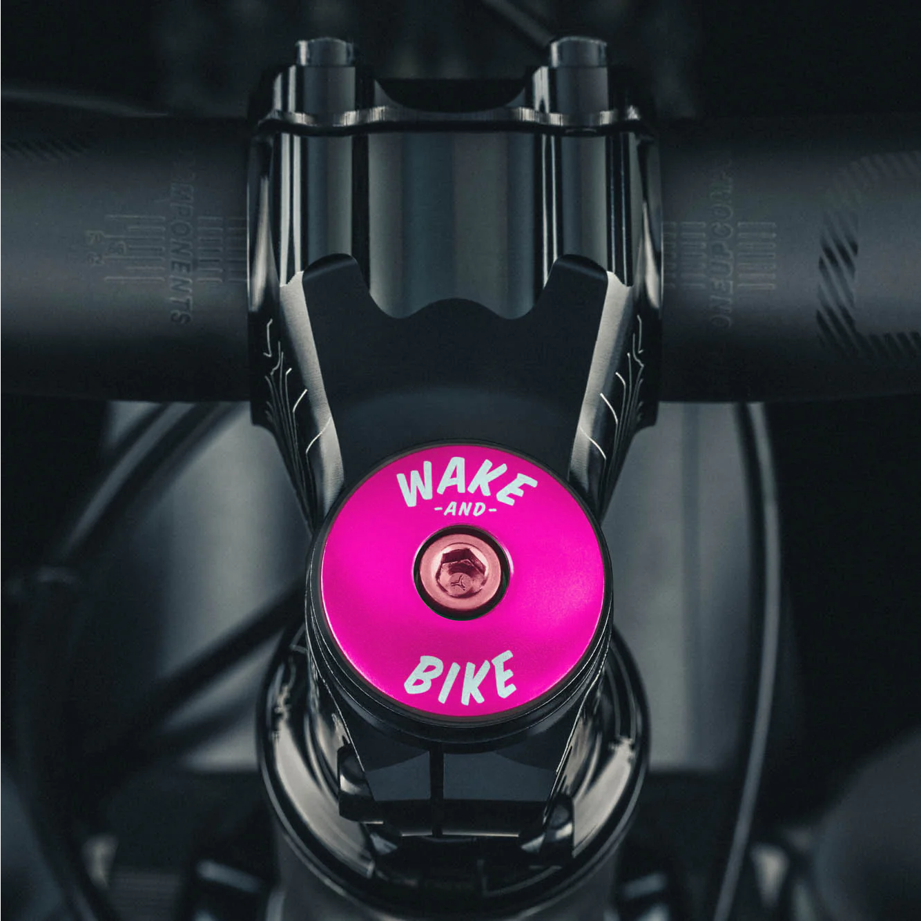 Hot pink headset cap made of aluminum for a lightweight and reliable addition to your bike.