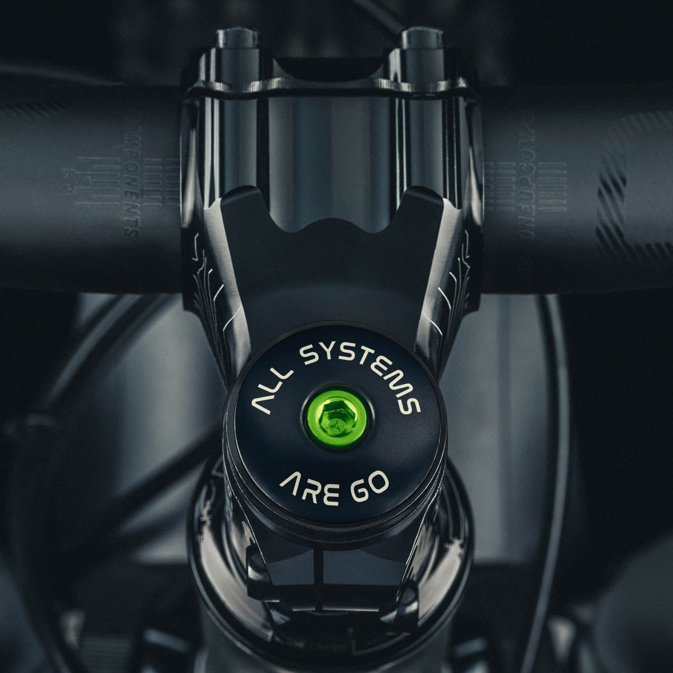 Black bicycle headset cap with "All Systems Are Go" laser engraving for custom bikes.
