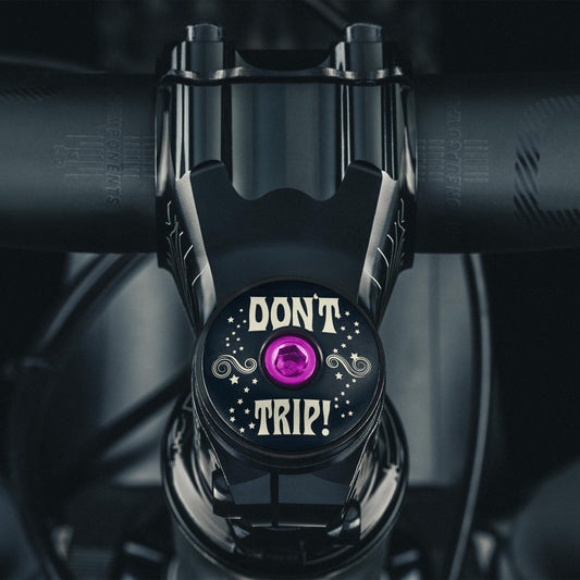 Don't Trip Black bicycle headset cap for custom bike accessories.