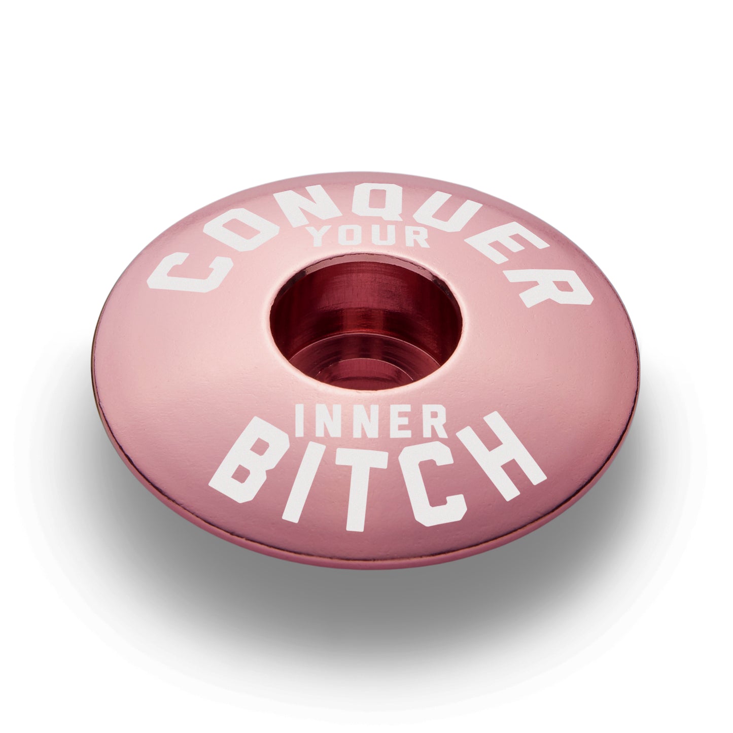 Bright pink stem topcap perfect for customizing your bike and showcasing unique bike components.