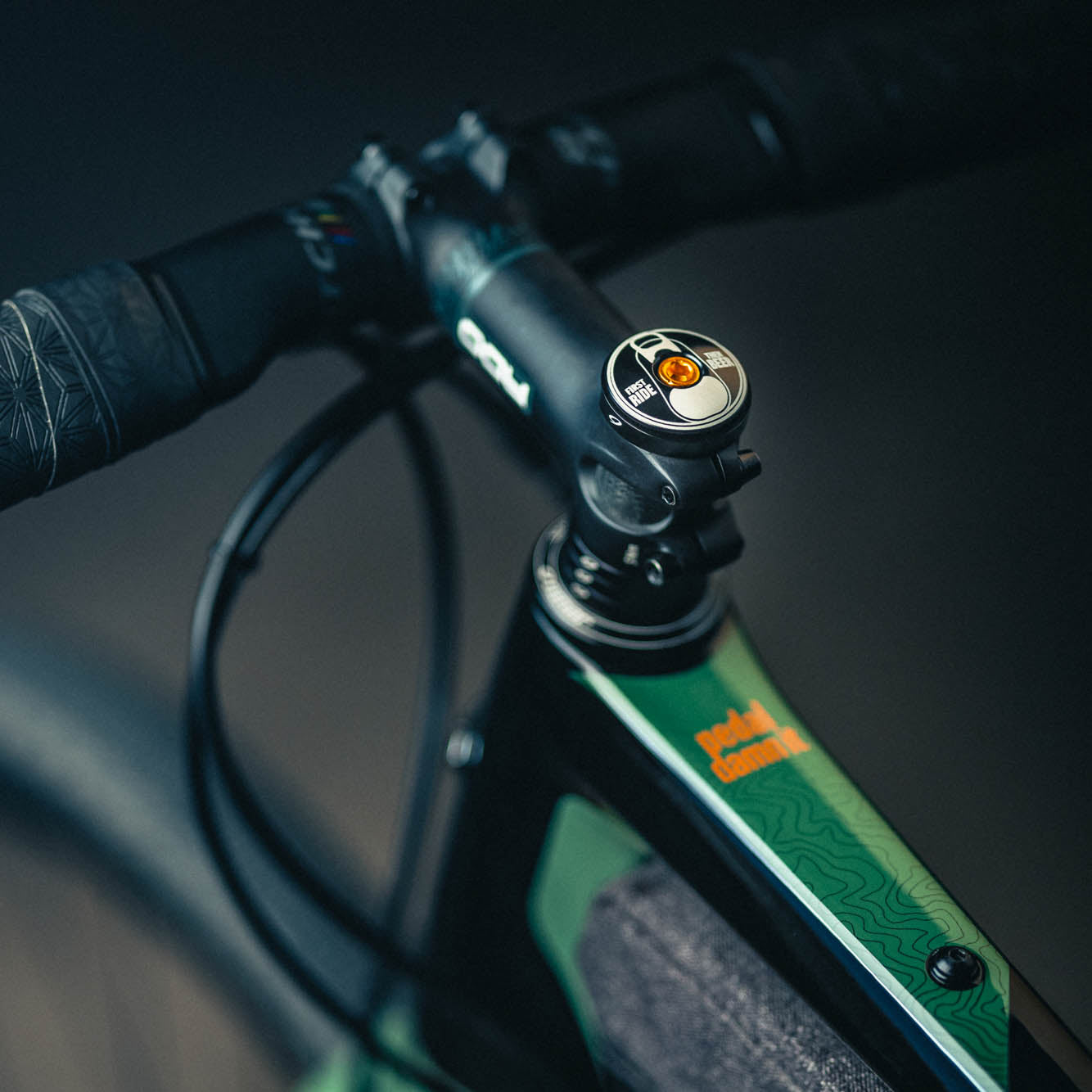 Black bike stem cap with "First Ride Then Beer" design for cycling accessories