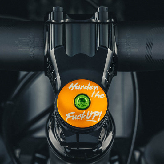 HTFU Bicycle Headset Cap made of lightweight aluminum for a 1 1/8-inch steerer tube.