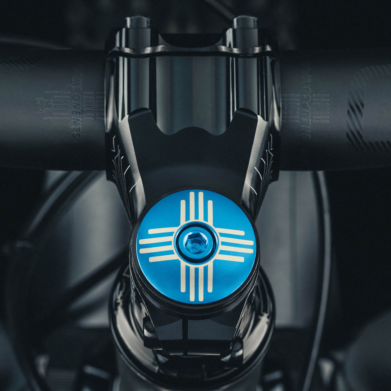 Custom bicycle headset cap with Zia symbol, perfect for personalizing your bike stem.