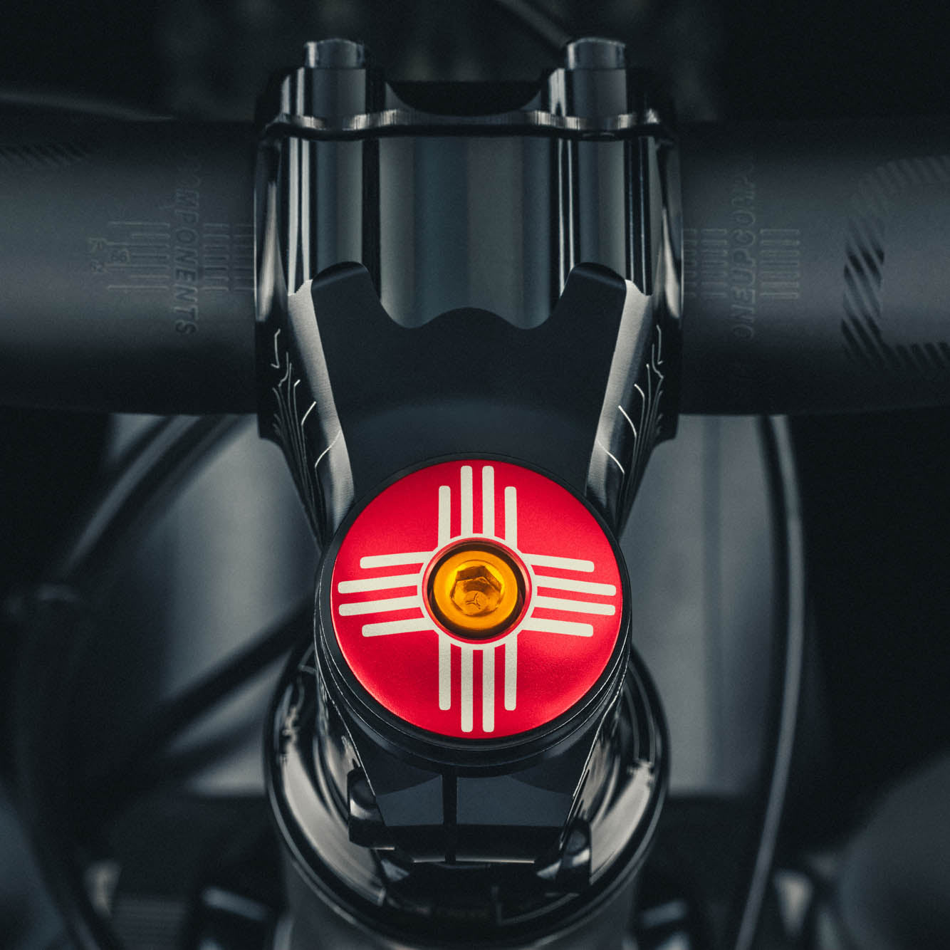 Custom bicycle headset cap with Zia symbol, perfect for personalizing your bike stem.