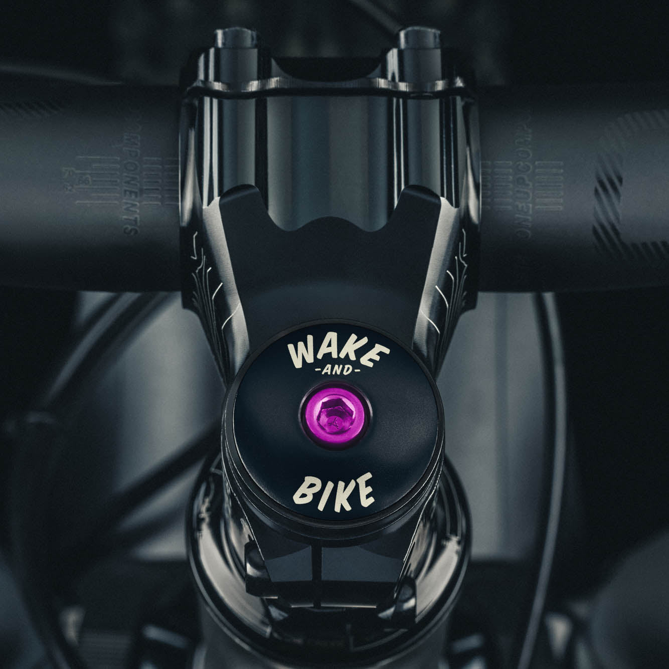 Custom bike headset cap made from durable aluminum designed for 1 1/8" steerer tubes and compatible with a variety of bikes.