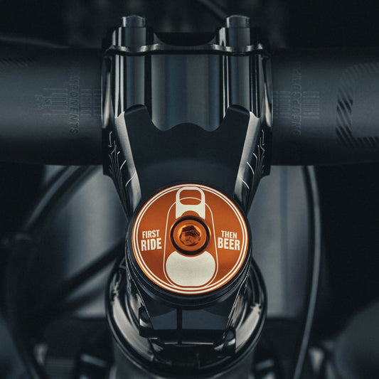 Brown headset top cap with "First Ride Then Beer" design for bicycles