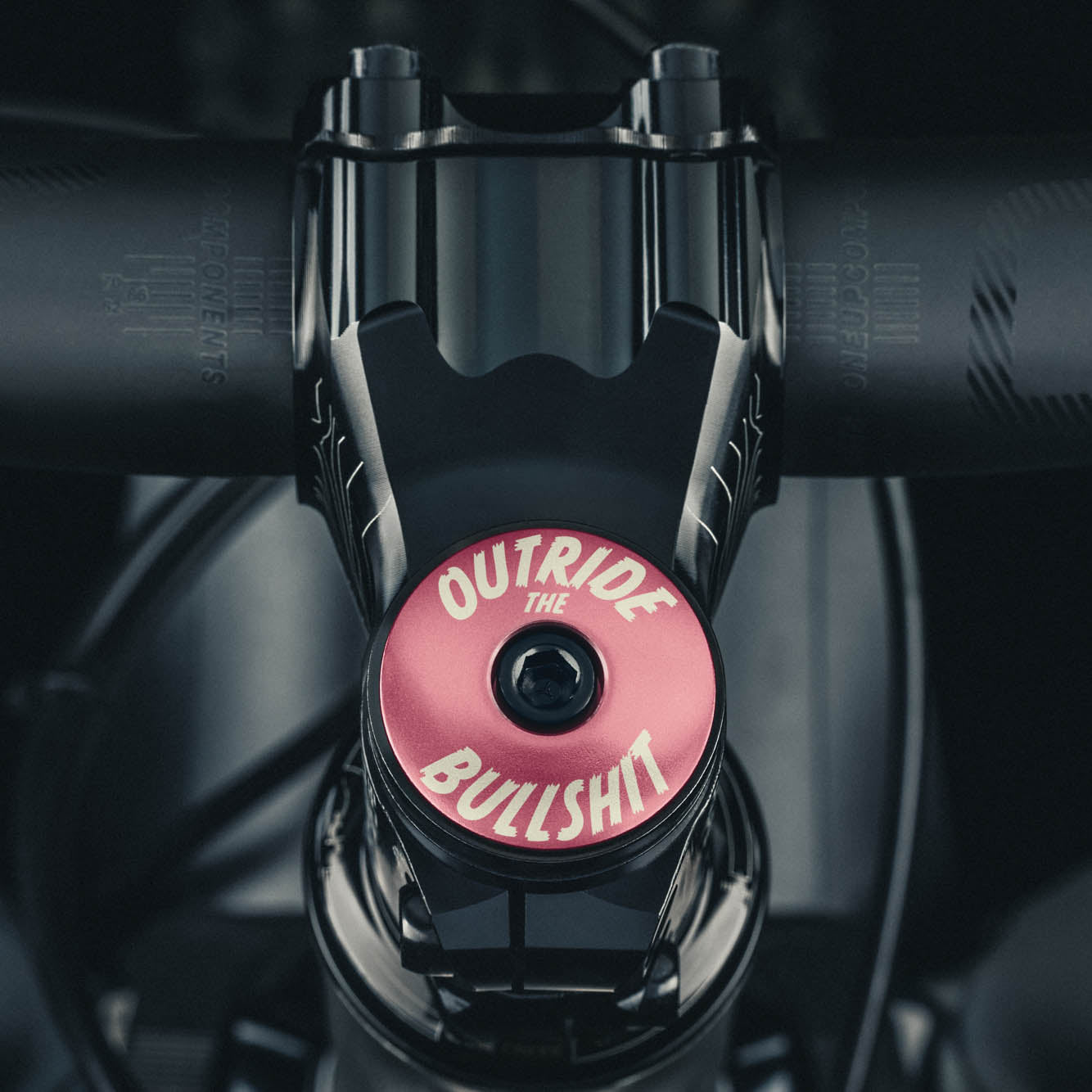 Outride The Bullshit Bicycle Headset Cap - Pink stem top cap for personalized bike components.