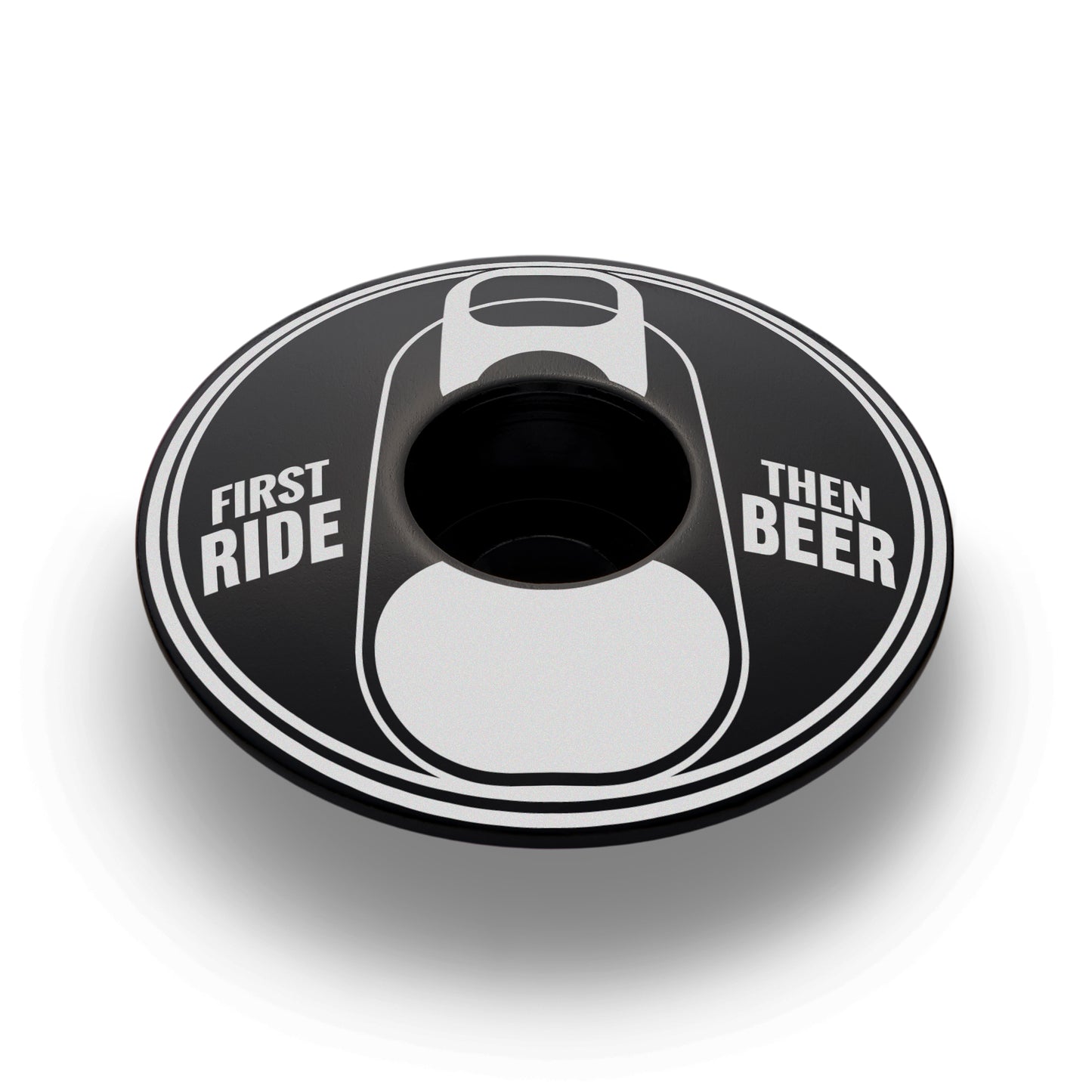 Black bike stem cap with "First Ride Then Beer" design for cycling accessories.