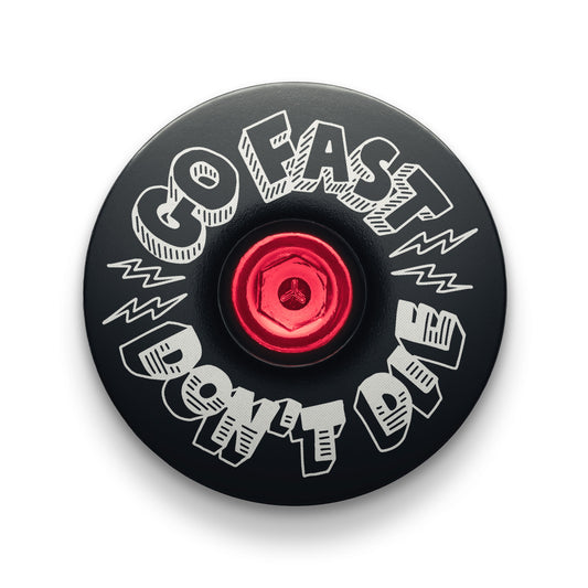 Black bicycle headset cap designed for a 1 1/8" steerer tube showcasing the Go Fast Don’t Die message.