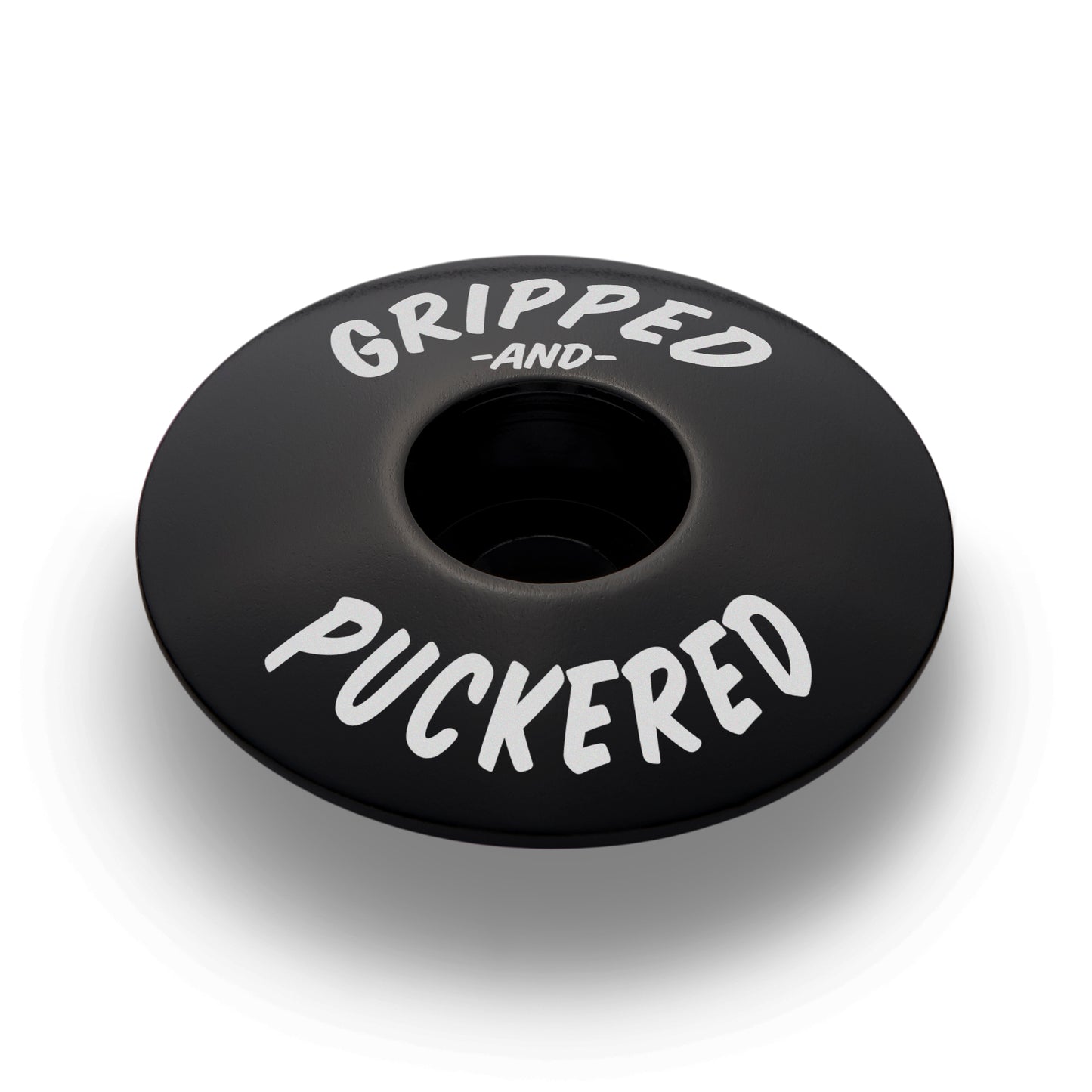 Black bicycle headset cap for personalizing your bike with lightweight and durable aluminum.