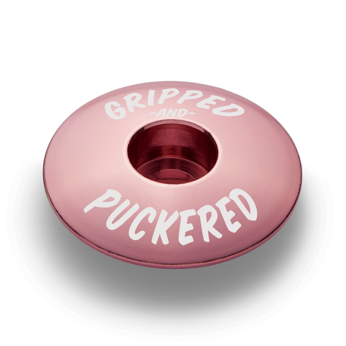 Pink stem top cap for a personalized cycling experience.