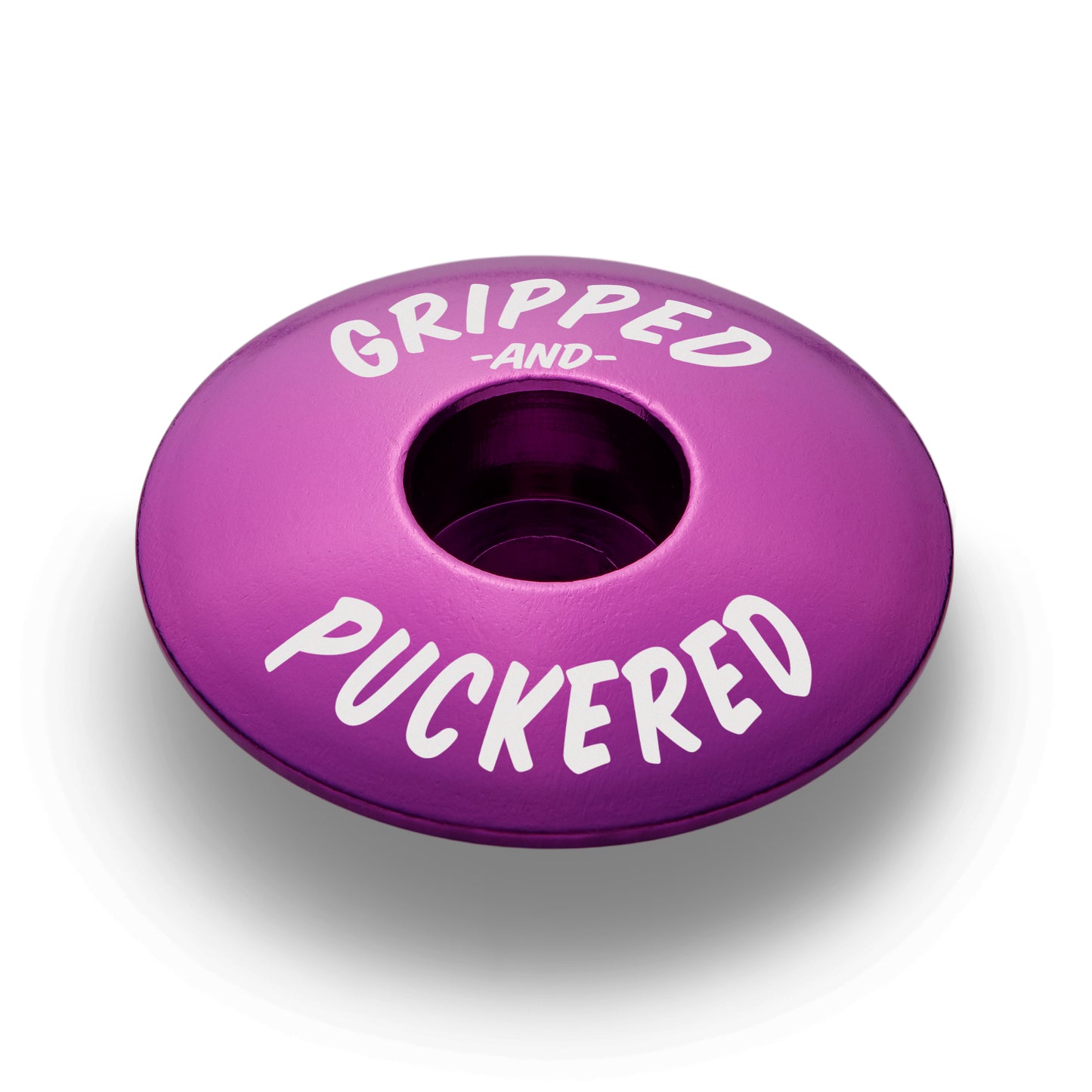 Purple cycling top cap designed for 1 1/8" steerer tubes.