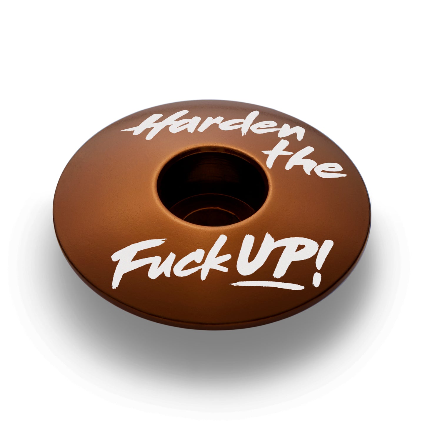 Brown bicycle headset top cap fits 1 1/8-inch steerer tubes made of lightweight aluminum.