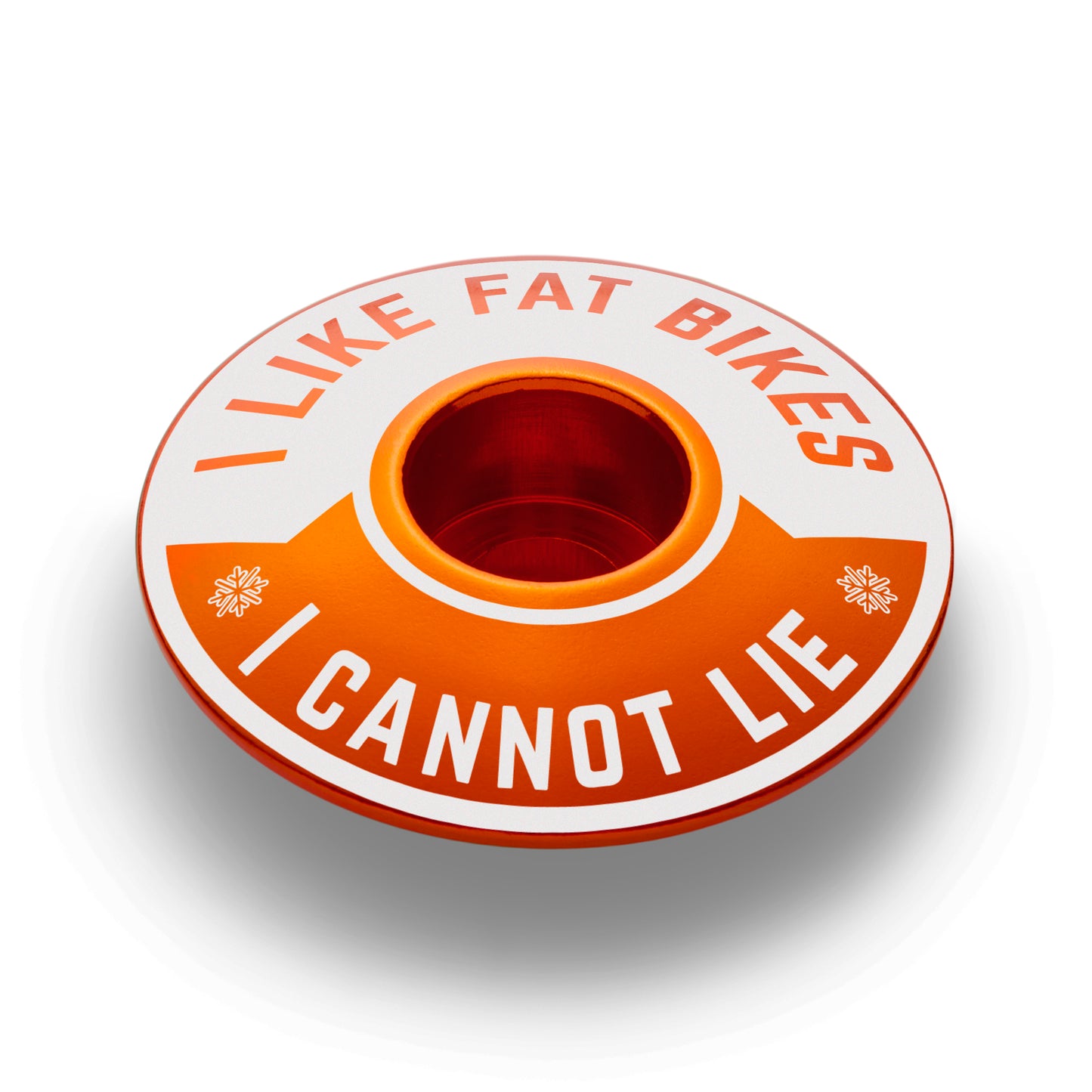 Orange bike headset top cover with "I Like Fat Bikes" design for mountain bike setups.