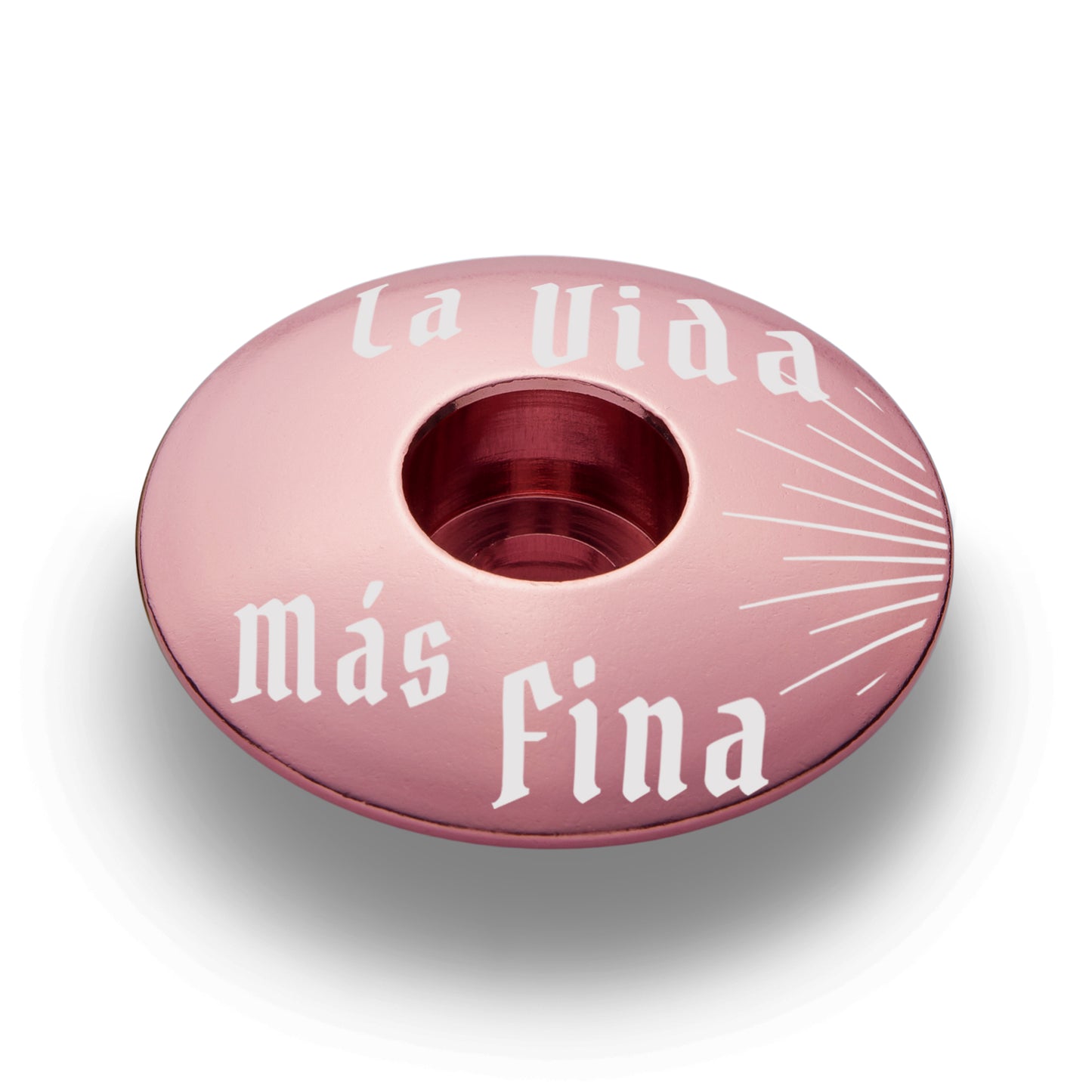 Pink bike stem top cap for a colorful bike accessory.