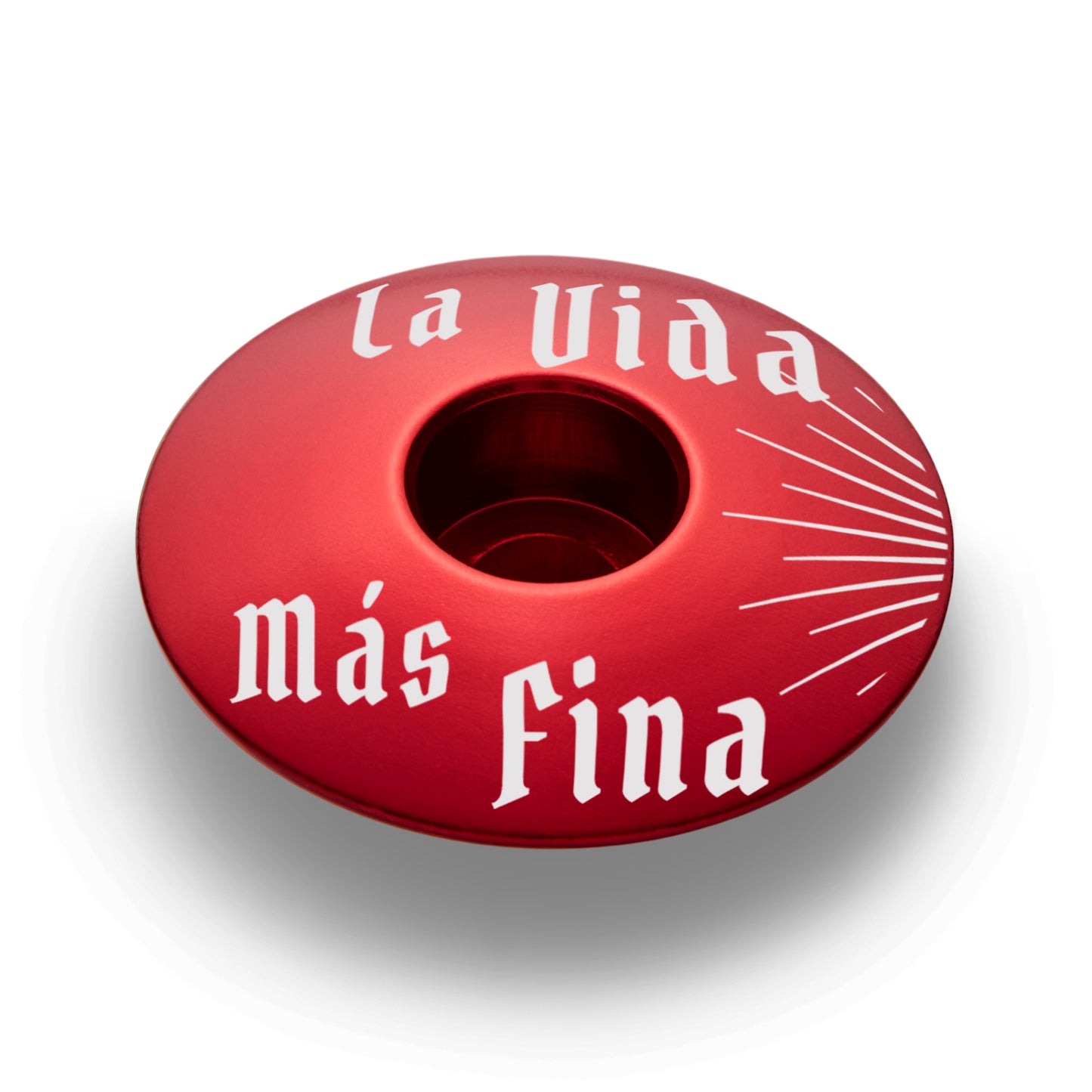 Red bike stem cap designed to personalize your ride.