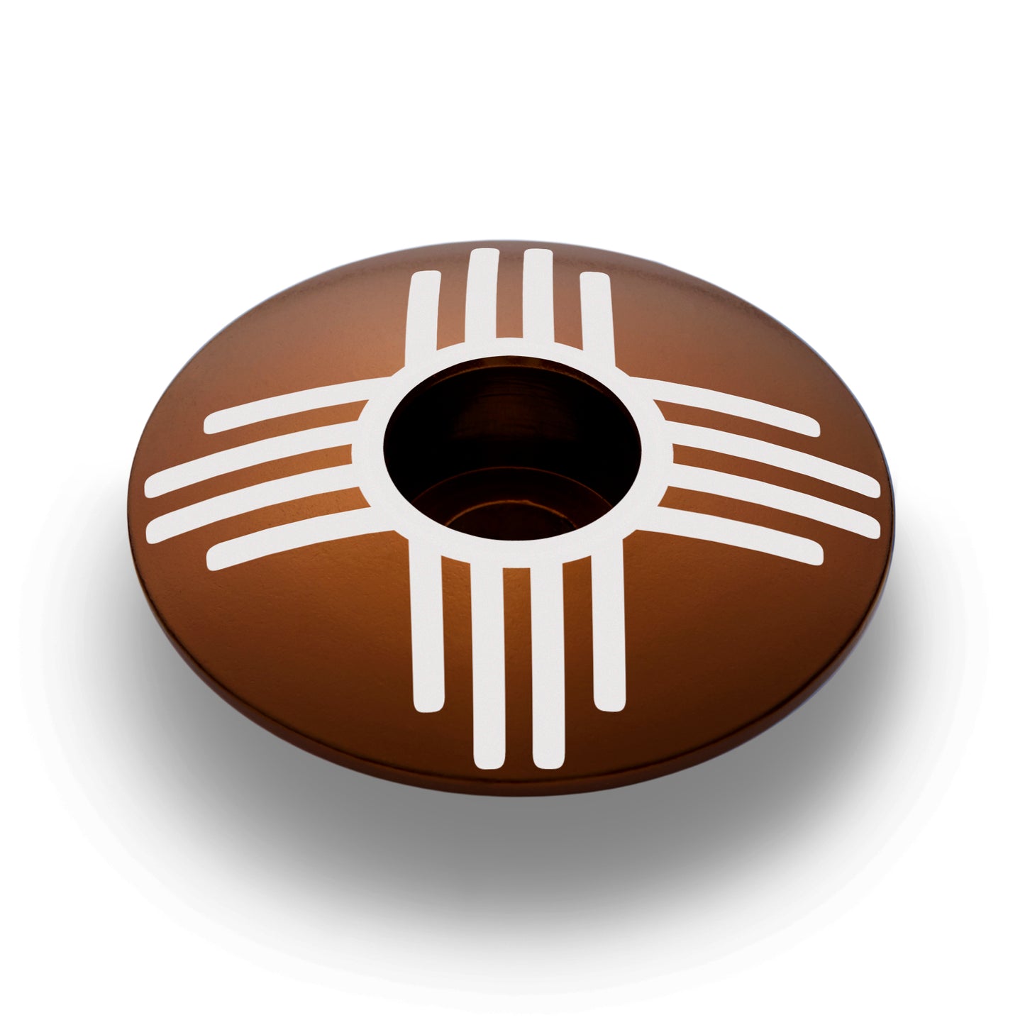 Custom brown bike headset top cap with Zia symbol, ideal for bike stem customization.