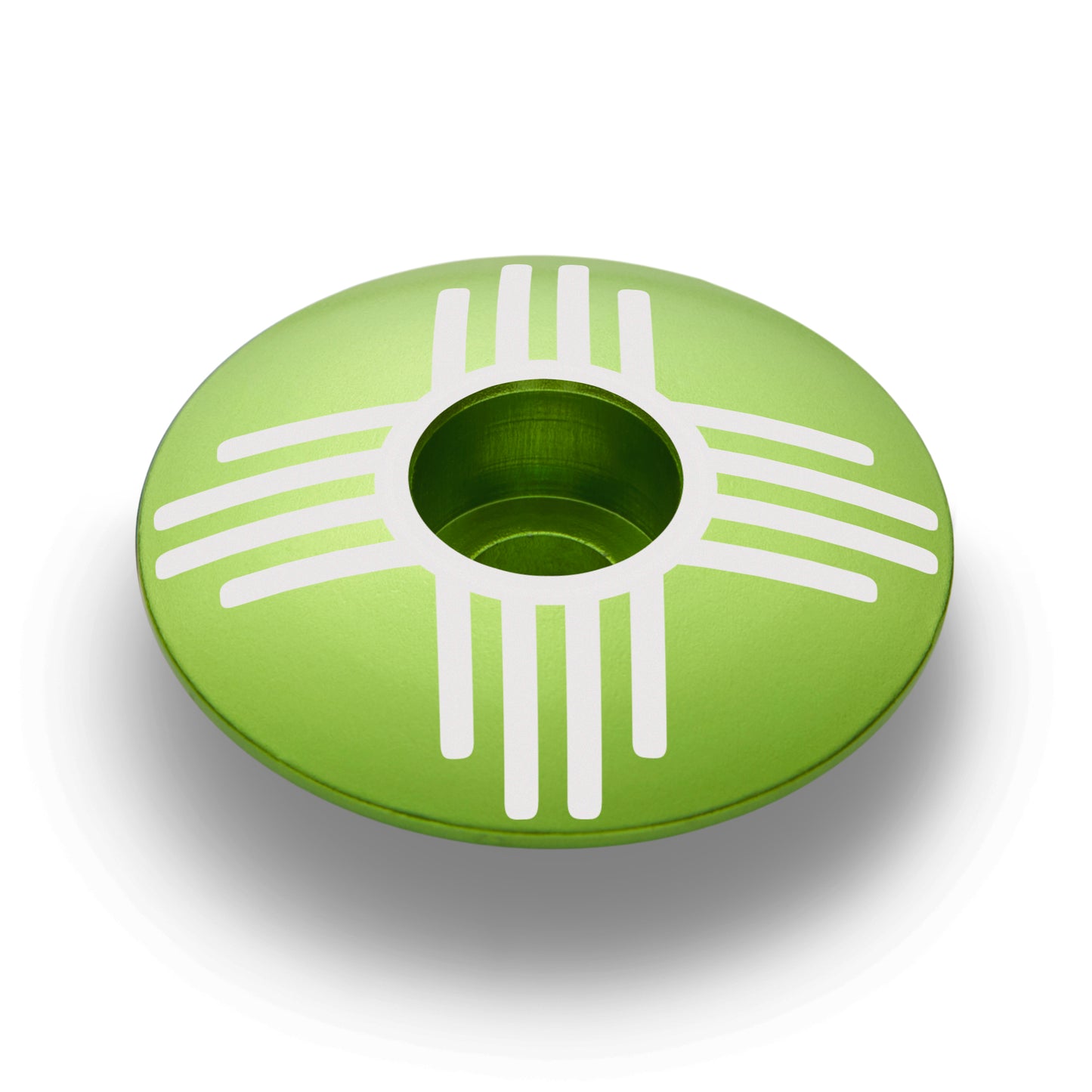 Lime green custom stem cap with Zia symbol, perfect for personalizing your bike.