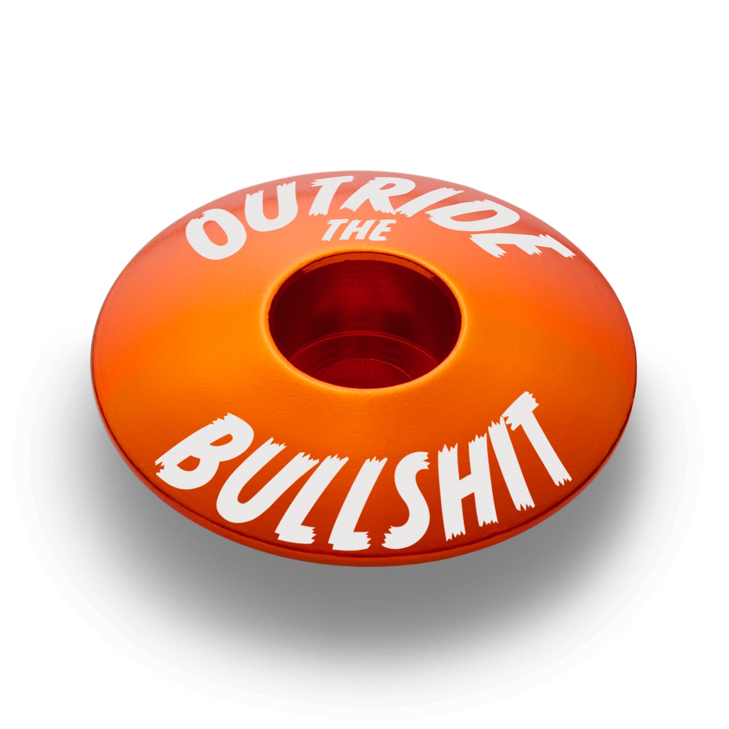 Orange bike headset cap for mountain and road bikes.