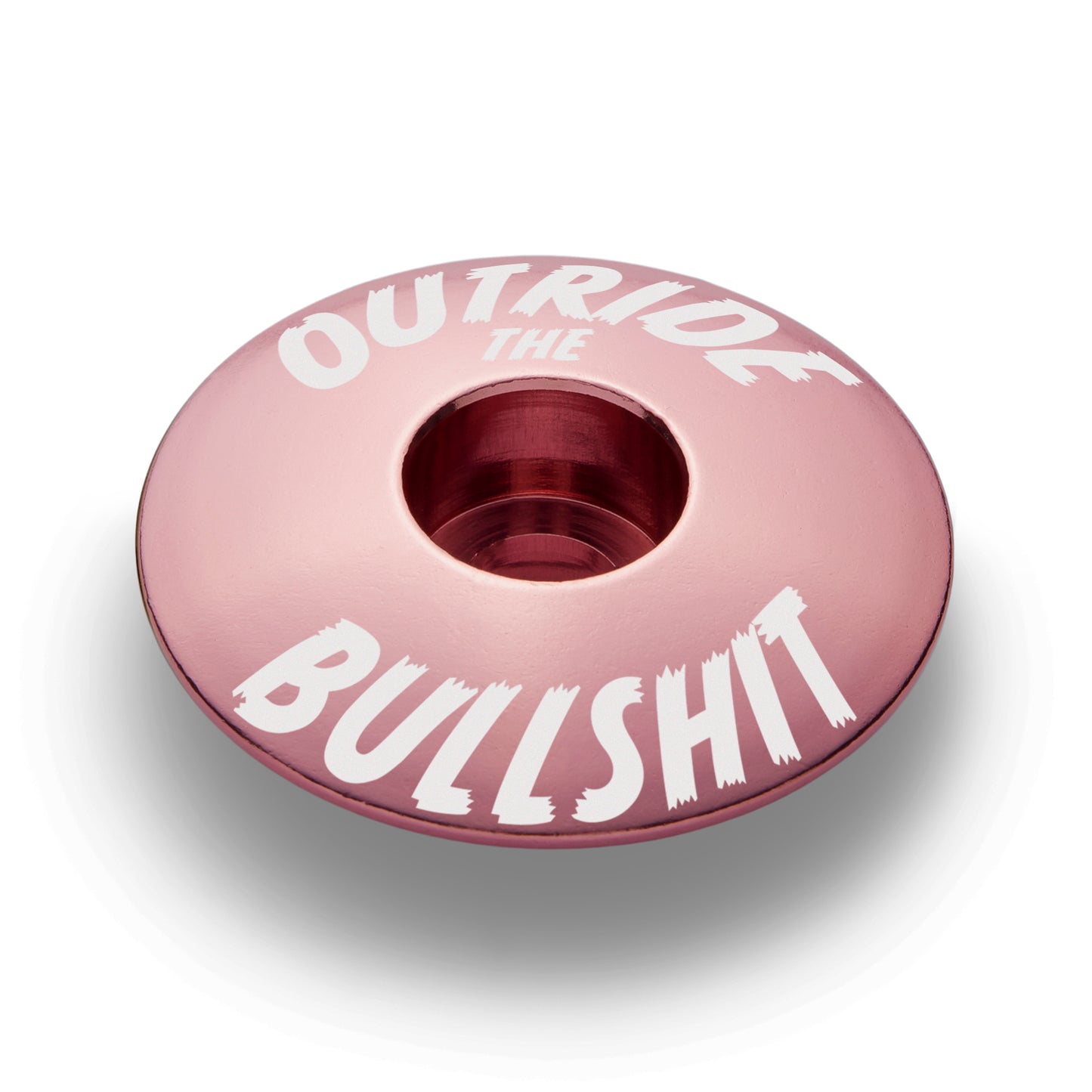 Pink stem top cap for personalized bike components.