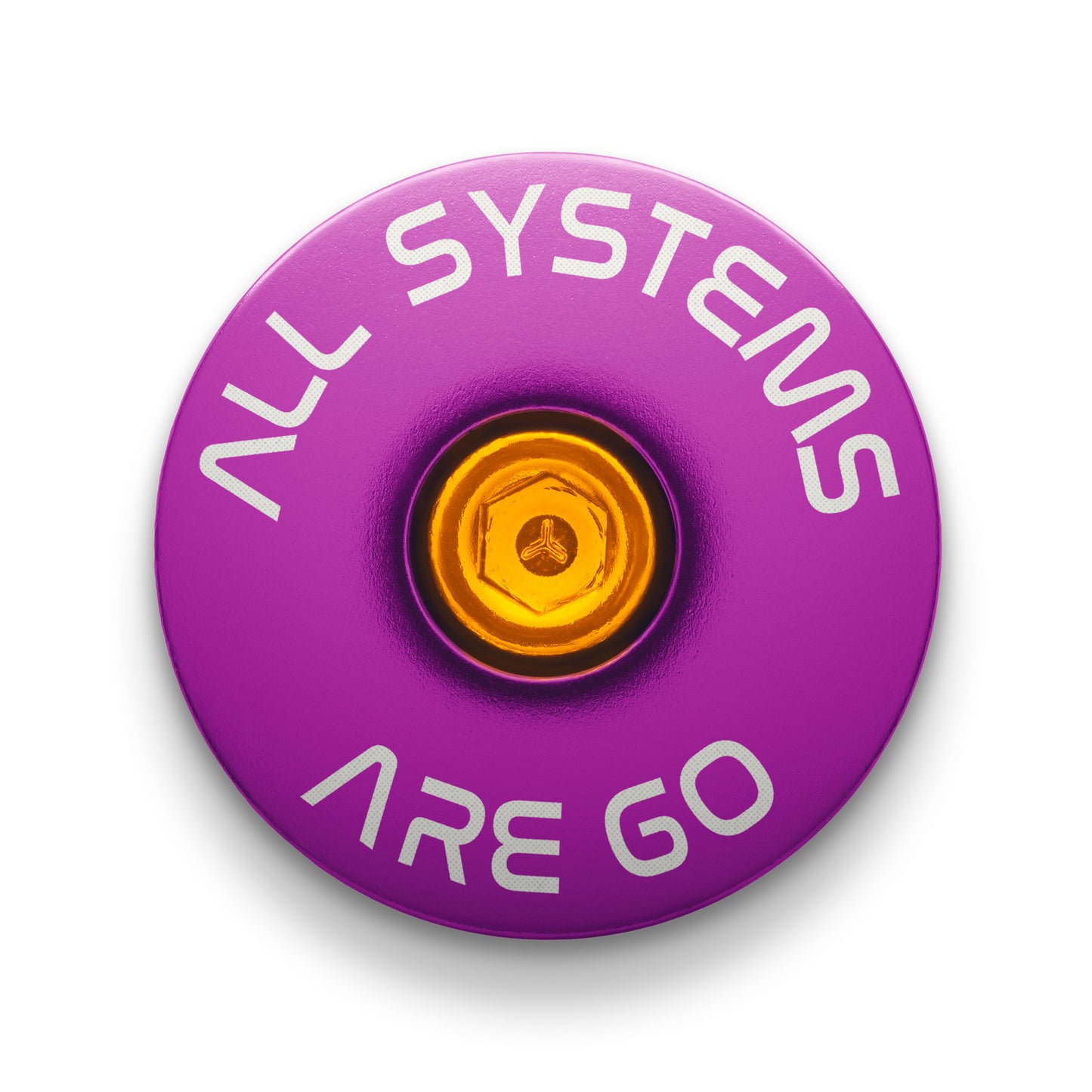 Purple bicycle stem cap showcasing "All Systems Are Go" engraving for personalized bikes.