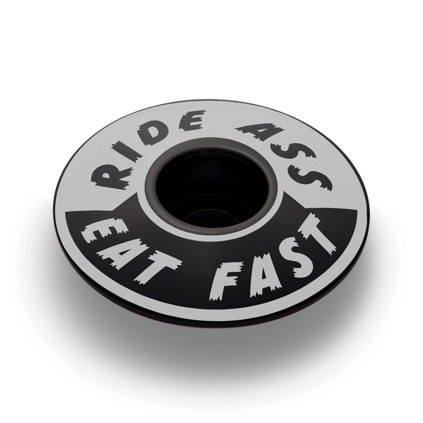Black Ride Ass Eat Fast bike headset cap for 1 1/8 steerer tubes adds personality to your bicycle top cap.
