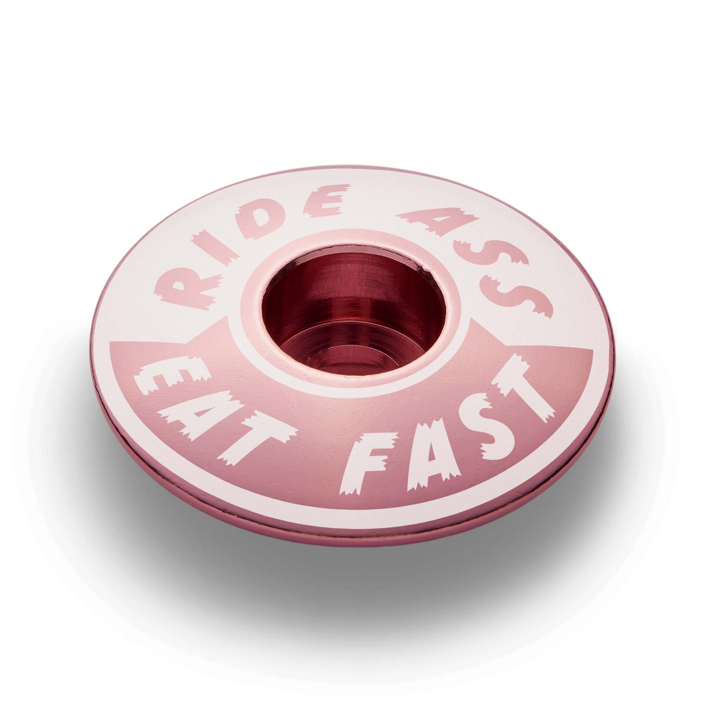 Pink Ride Ass Eat Fast bike headset cap for 1 1/8 steerer tubes adds personality to your bicycle top cap.