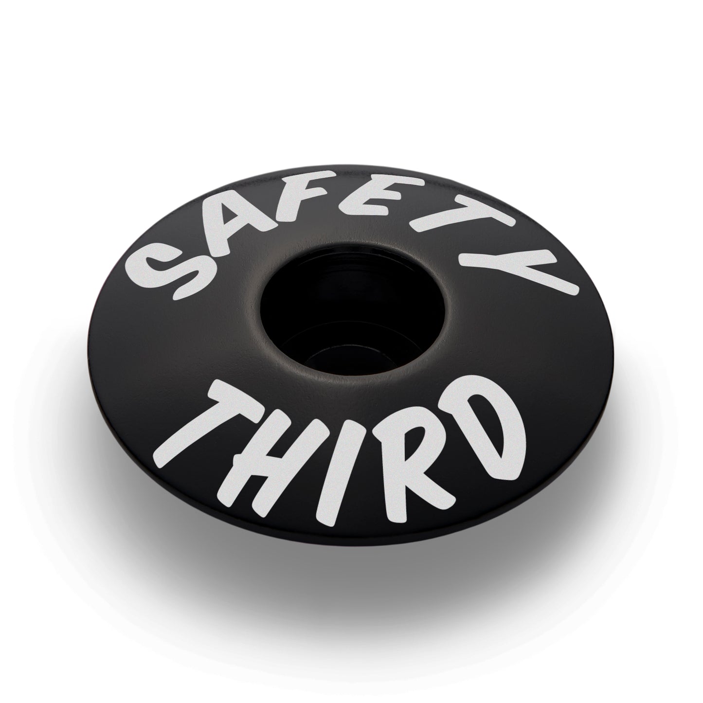 Black bicycle headset cap for 1 1/8" steerer tubes perfect for custom bike components.