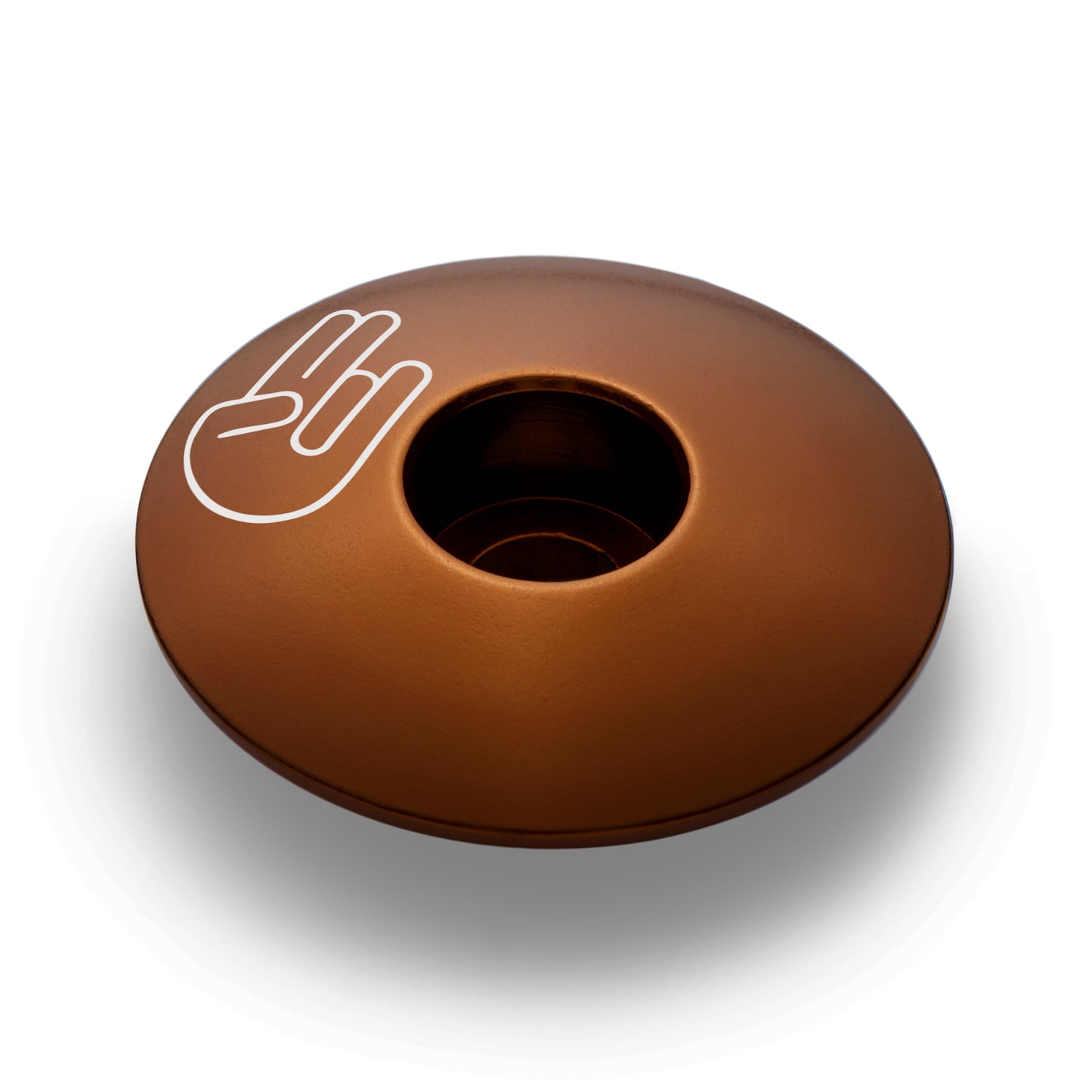 Brown bike stem cap made of lightweight aluminum designed to fit standard bicycle steerer tubes.