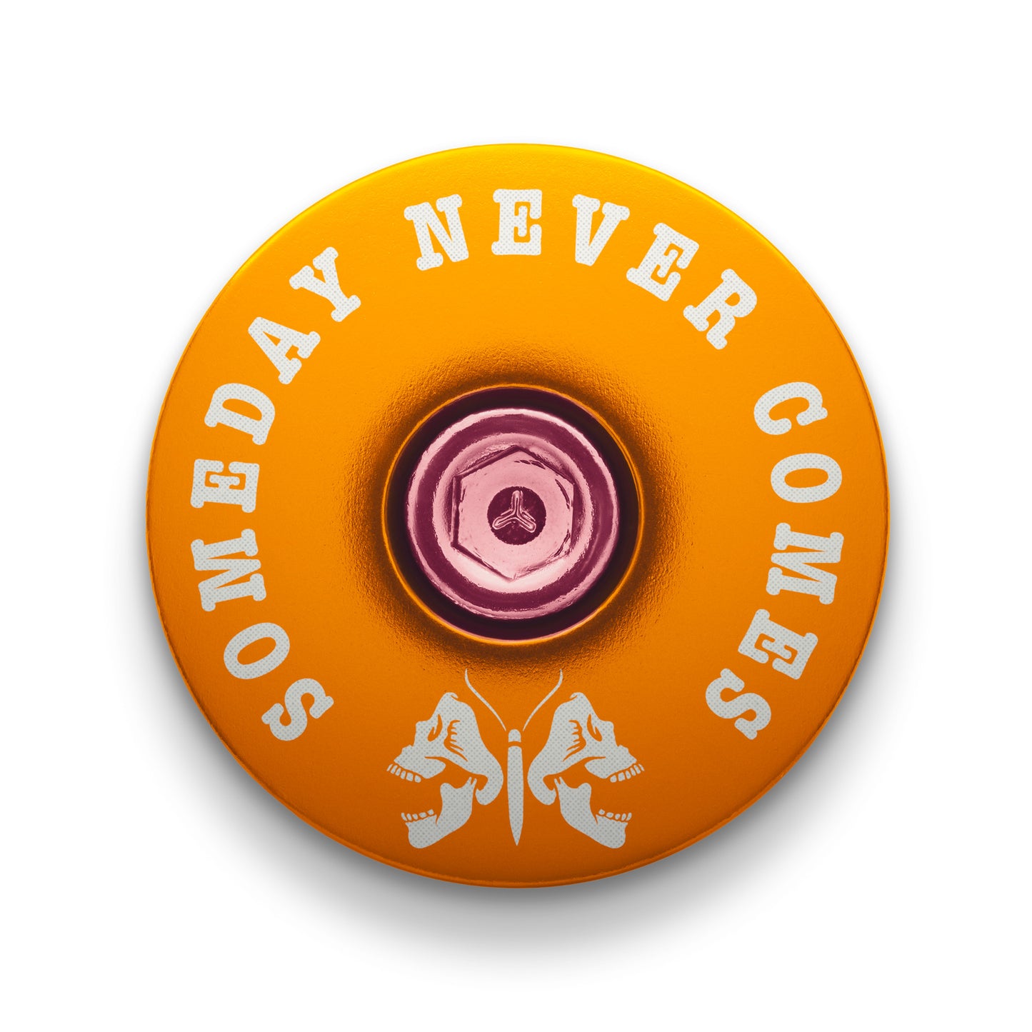 Gold bicycle headset cap with a death moth design for mountain bike customization.