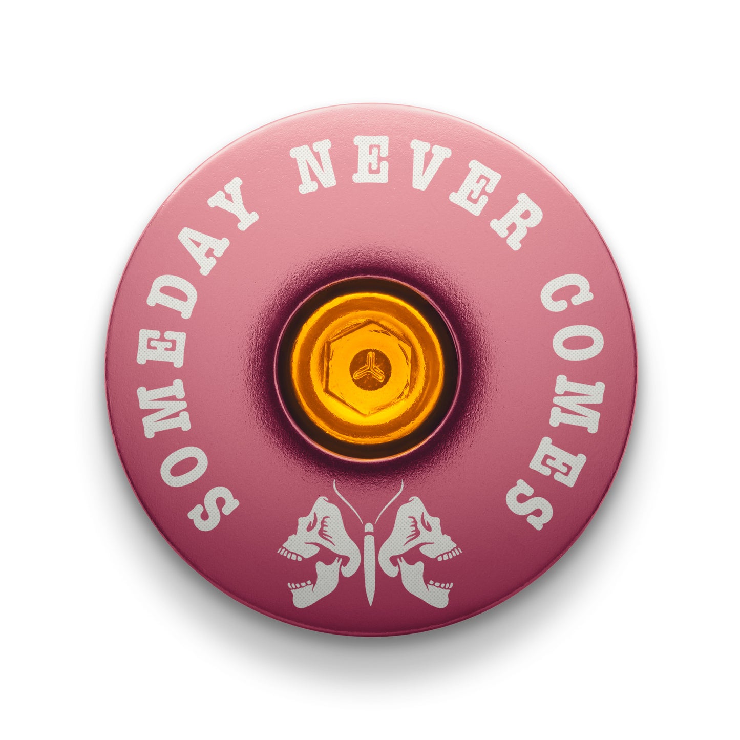 Pink stem top cap with a death moth design for mountain bike customization.