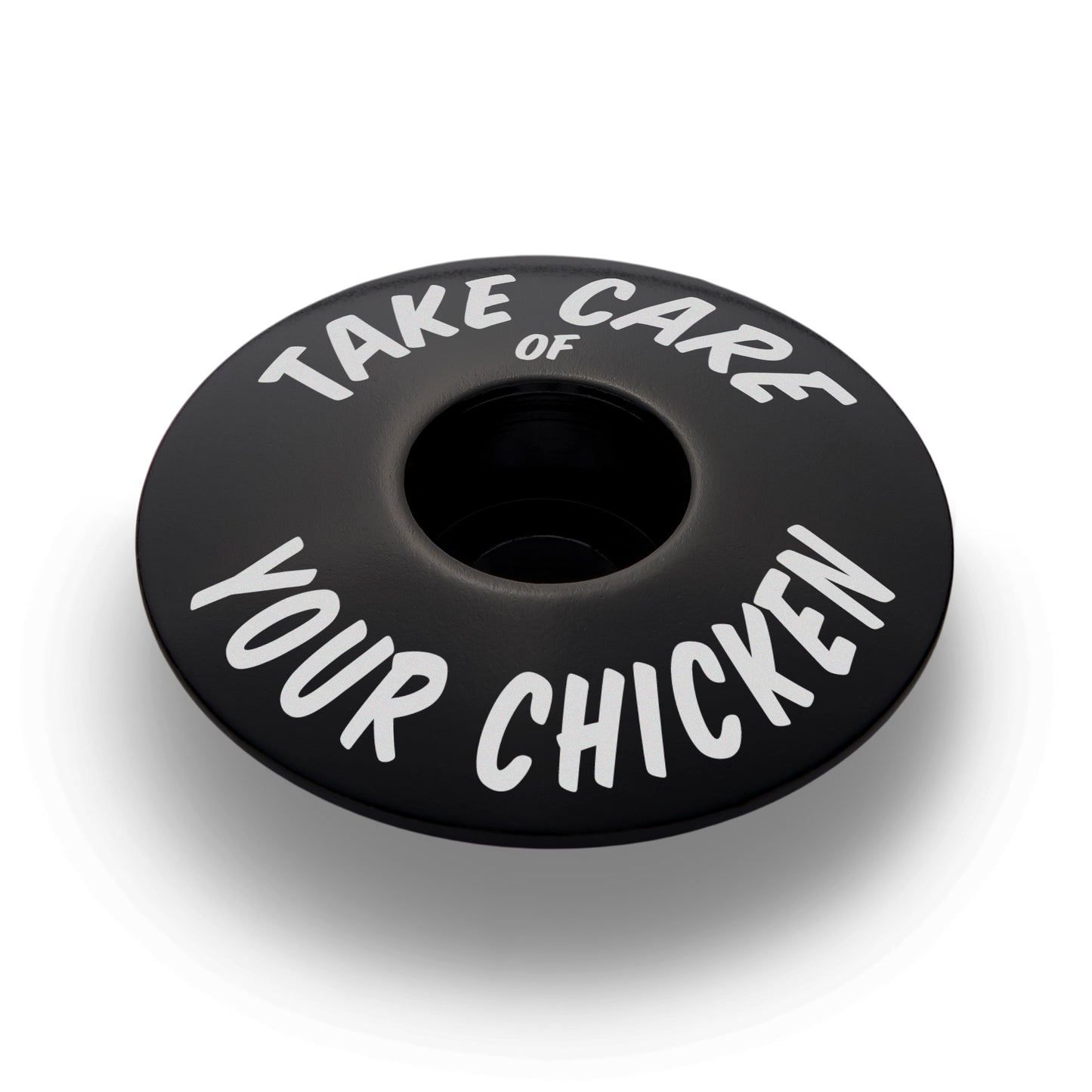 Black bicycle headset cap for 1 1/8 inch steerer tubes made from durable aluminum for bike customization.