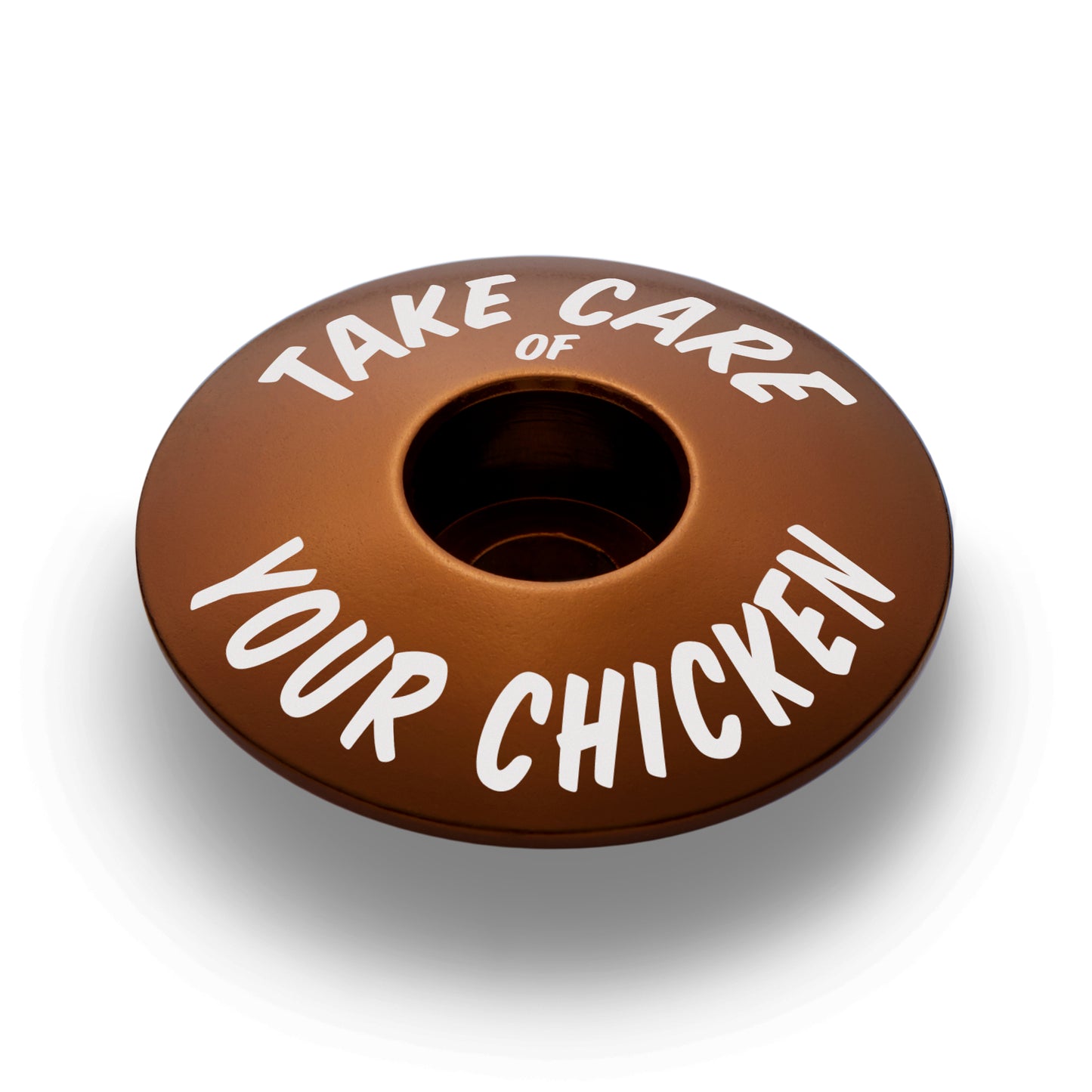 Brown bicycle headset cap for 1 1/8 inch steerer tubes made from durable aluminum for bike customization.