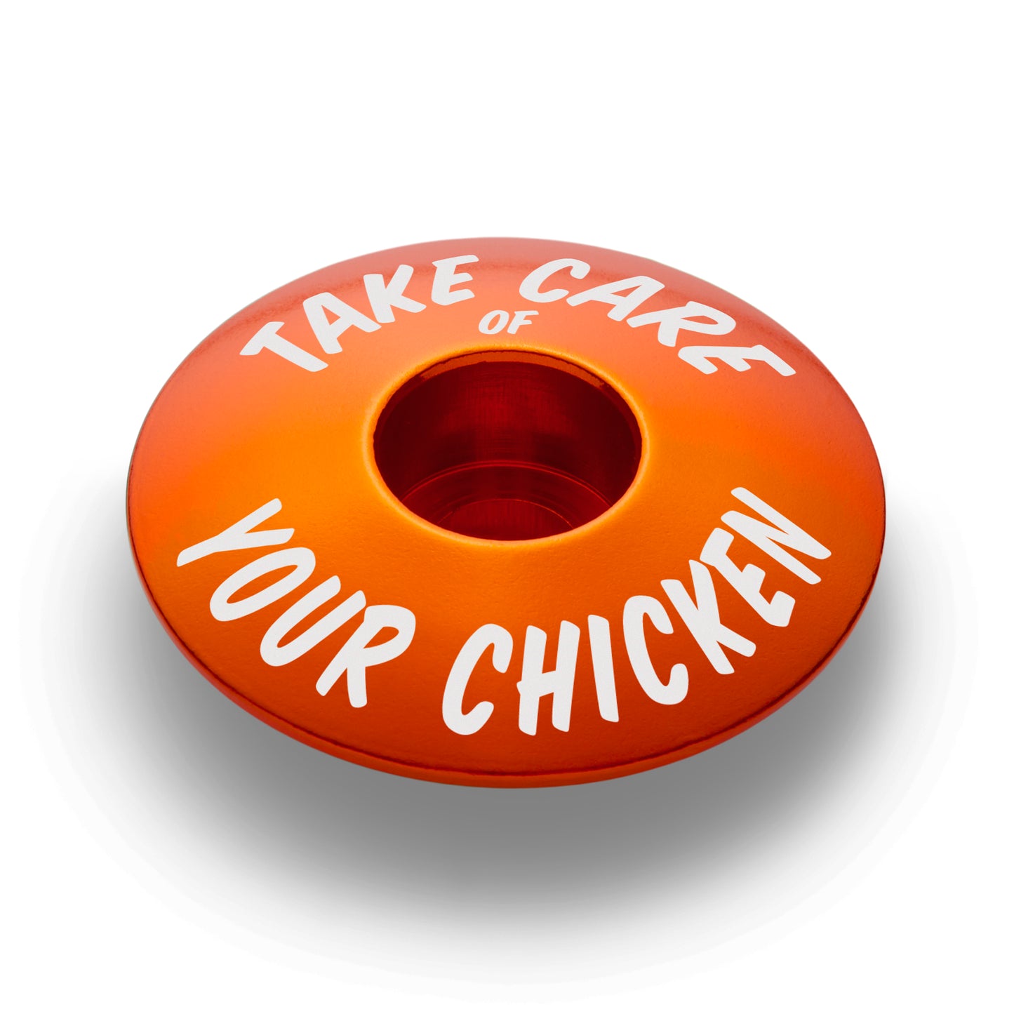 Orange bicycle headset cap for 1 1/8 inch steerer tubes made from durable aluminum for bike customization.