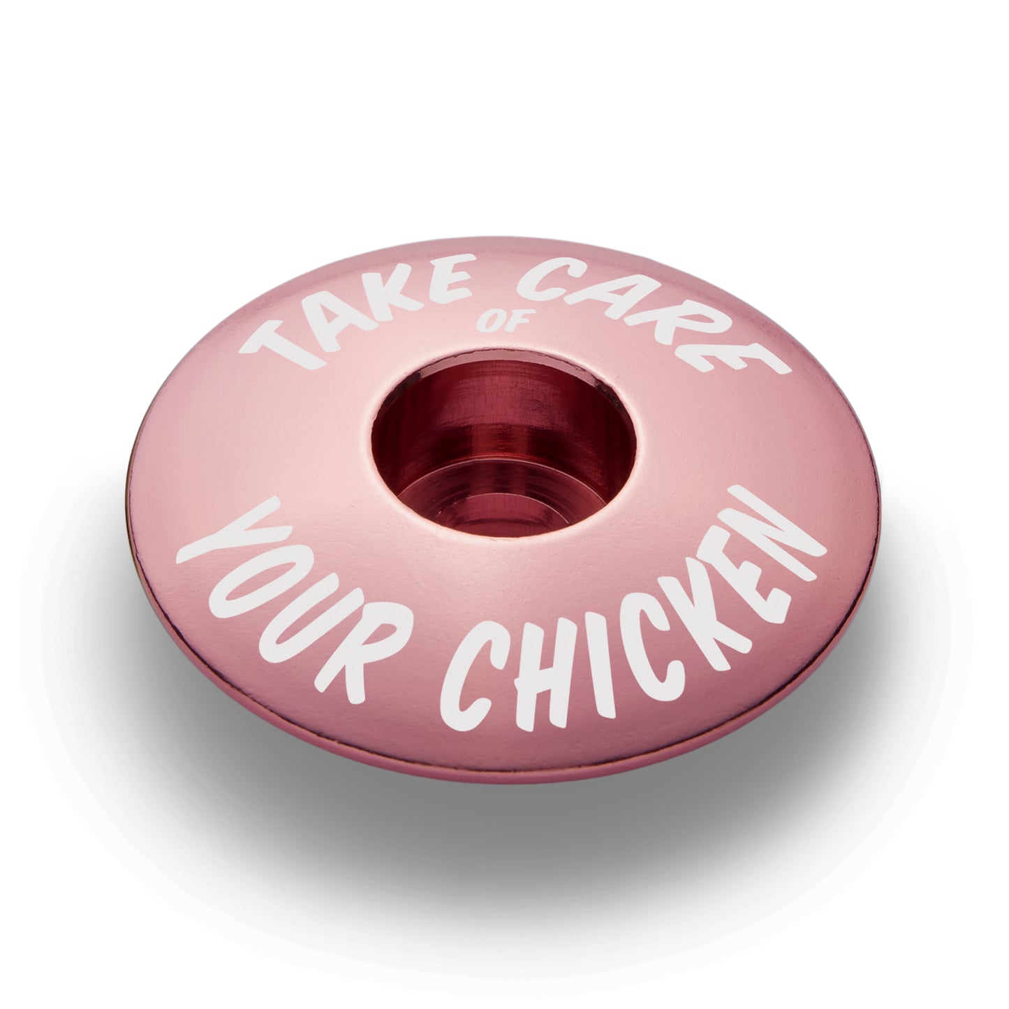 Pink stem top cap for 1 1/8 inch steerer tubes made from durable aluminum for bike customization.